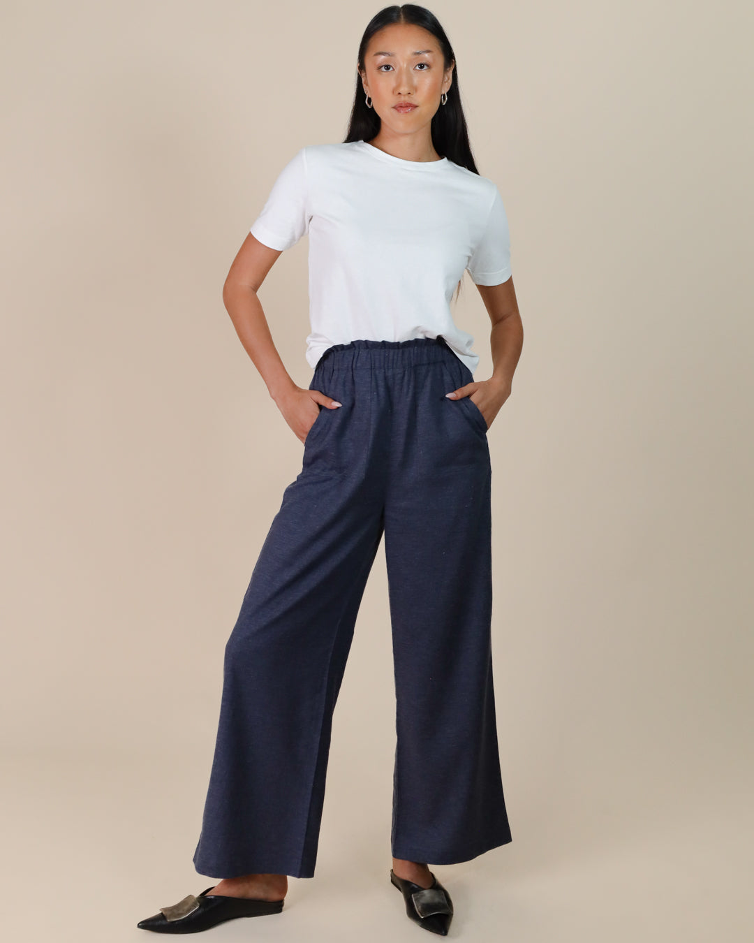Woman wearing Juana Lyricist High Rise Pull-on Pants made from hemp blend twill with Tencel™, styled for sustainable women’s clothing.