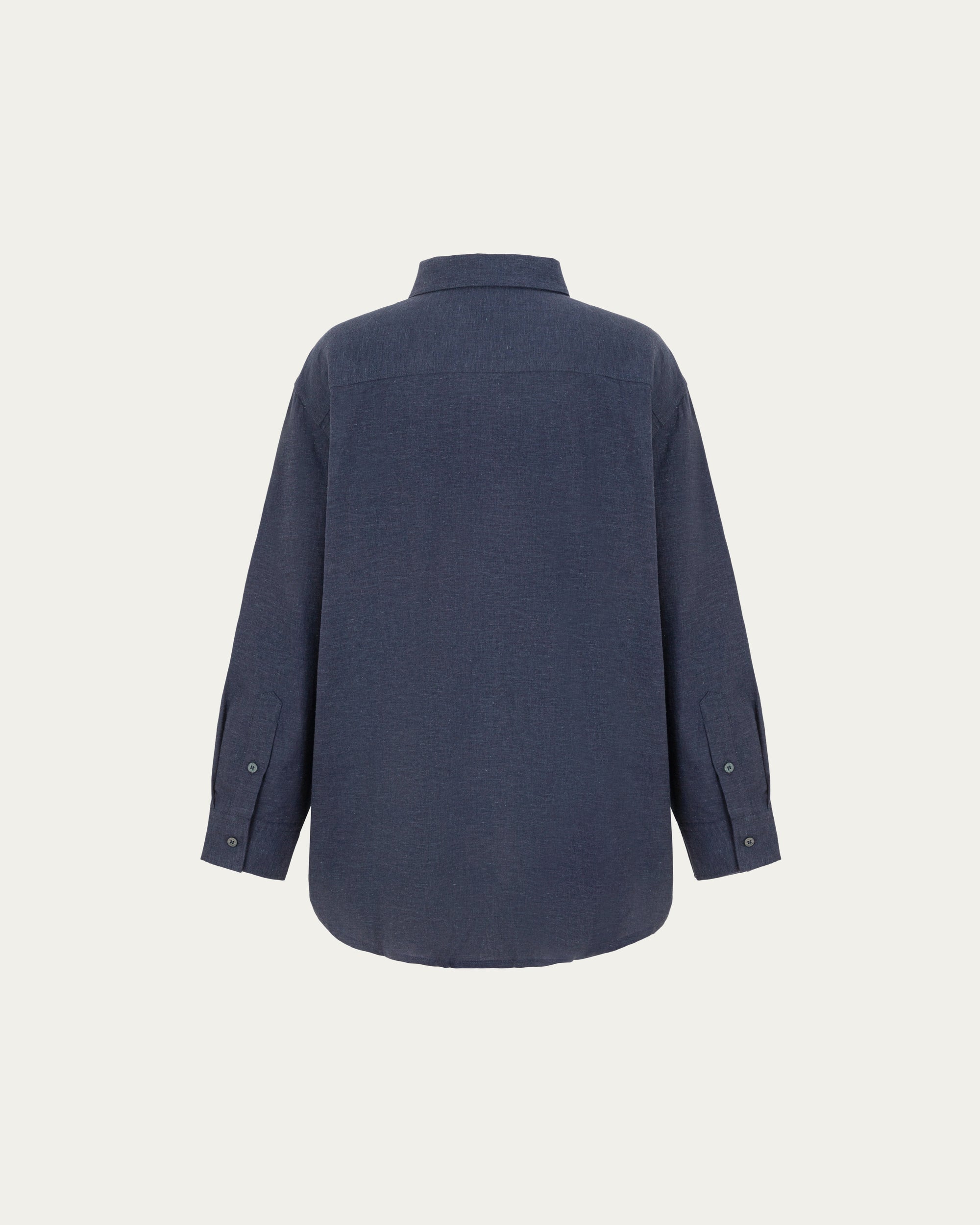 Lyricist Oversized Shirt in indigo blue on ghost mannequin, back view showing relaxed drape and yoke.