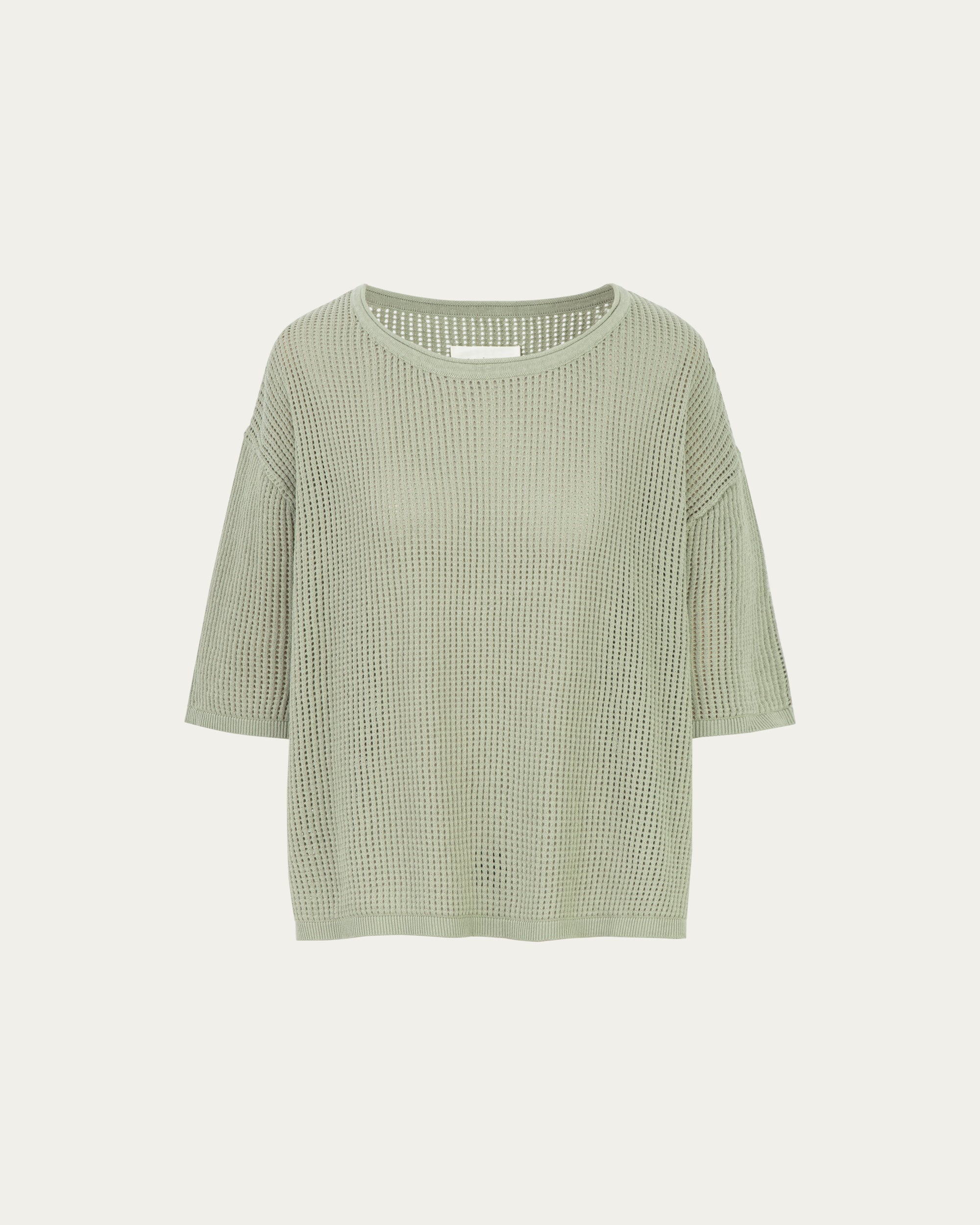 Juana Marina Crochet Tee Sage (sustainable cotton–hemp) ghost front showing boxy silhouette and elbow-length sleeves