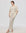 Juana Marina Open Knit Skirt Cream (sustainable cotton–hemp) on model showing relaxed maxi drape and open knit texture