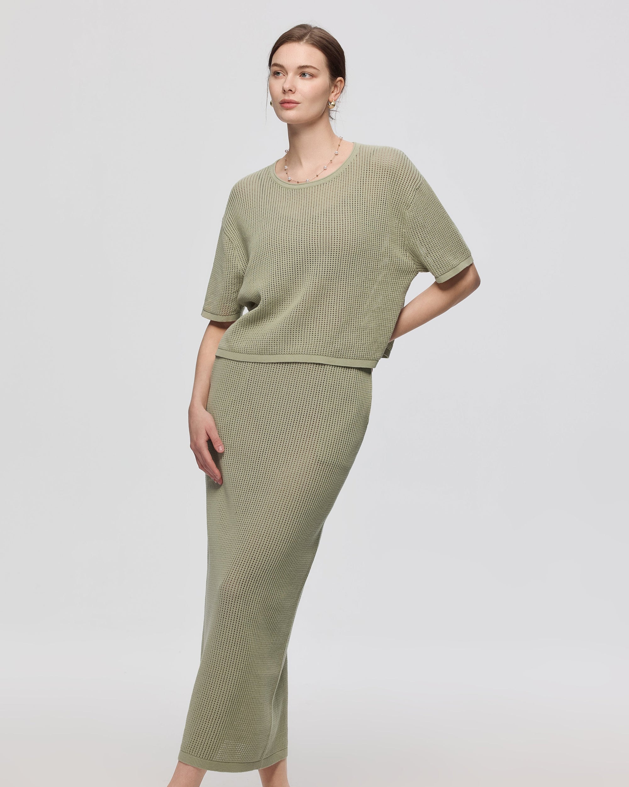 Juana Marina Open Knit Skirt Sage (sustainable cotton–hemp) on model showing casual top pairing and elongated silhouette