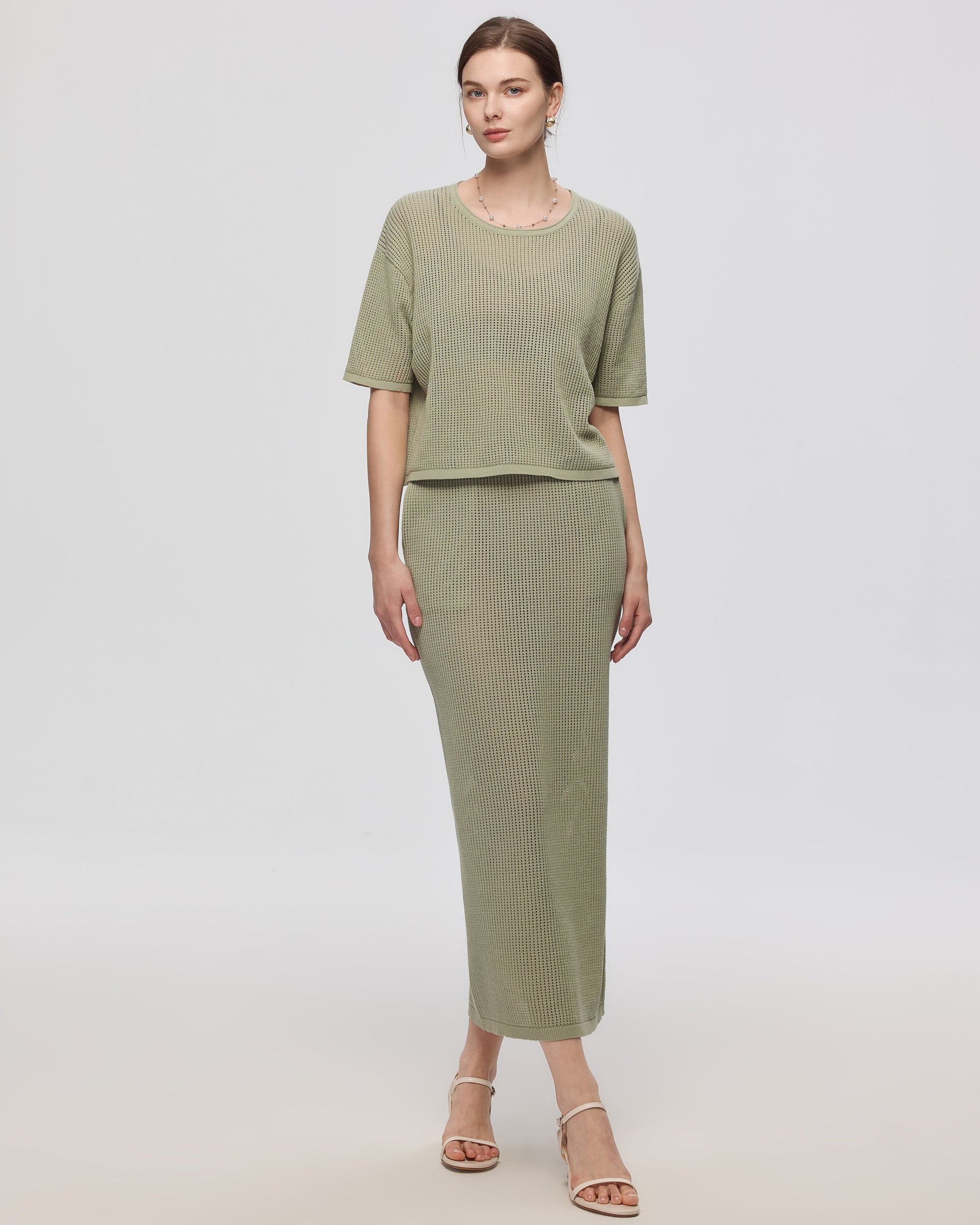 Juana Marina Open Knit Skirt Sage (sustainable cotton–hemp) on model showing relaxed maxi drape and open knit texture