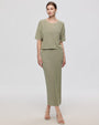 Juana Marina Open Knit Skirt Sage (sustainable cotton–hemp) on model showing relaxed maxi drape and open knit texture