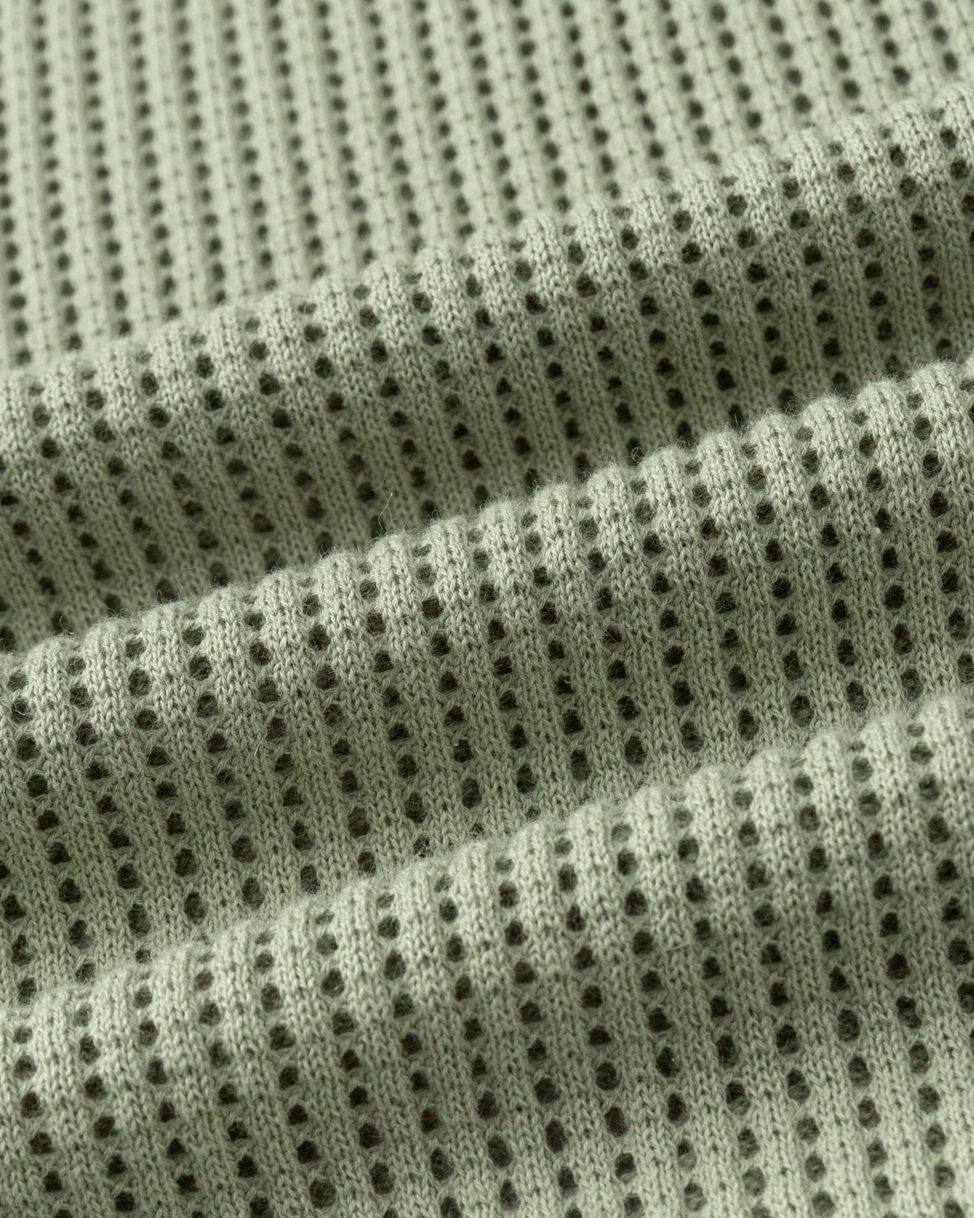 Juana Marina Open Knit Skirt Sage (sustainable cotton–hemp) textile close-up showing breathable open knit stitch definition