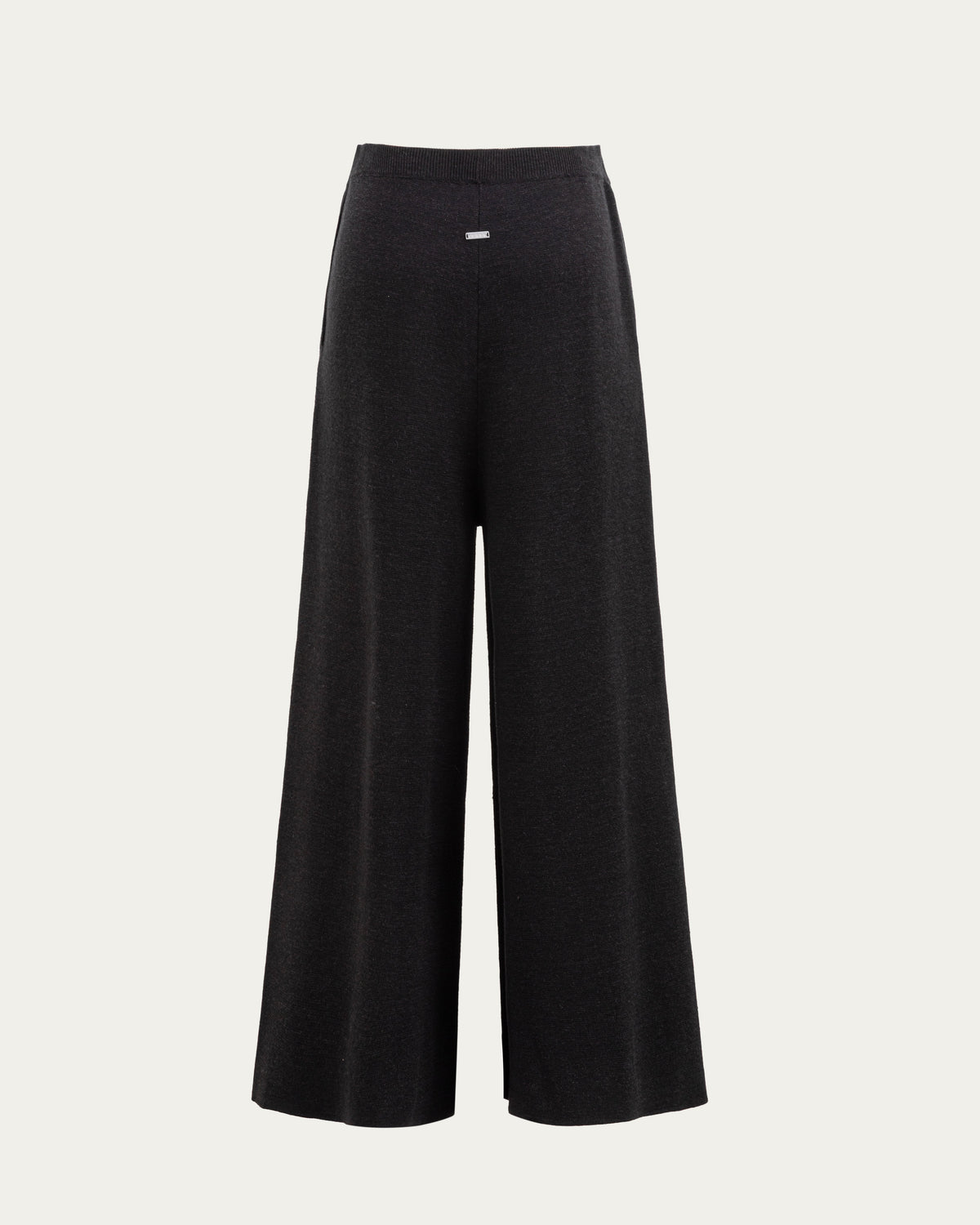 Juana Mid-Rise Cropped Pants in Black (merino wool–hemp–silk) shown from the back with a clean waistband and cropped hem.