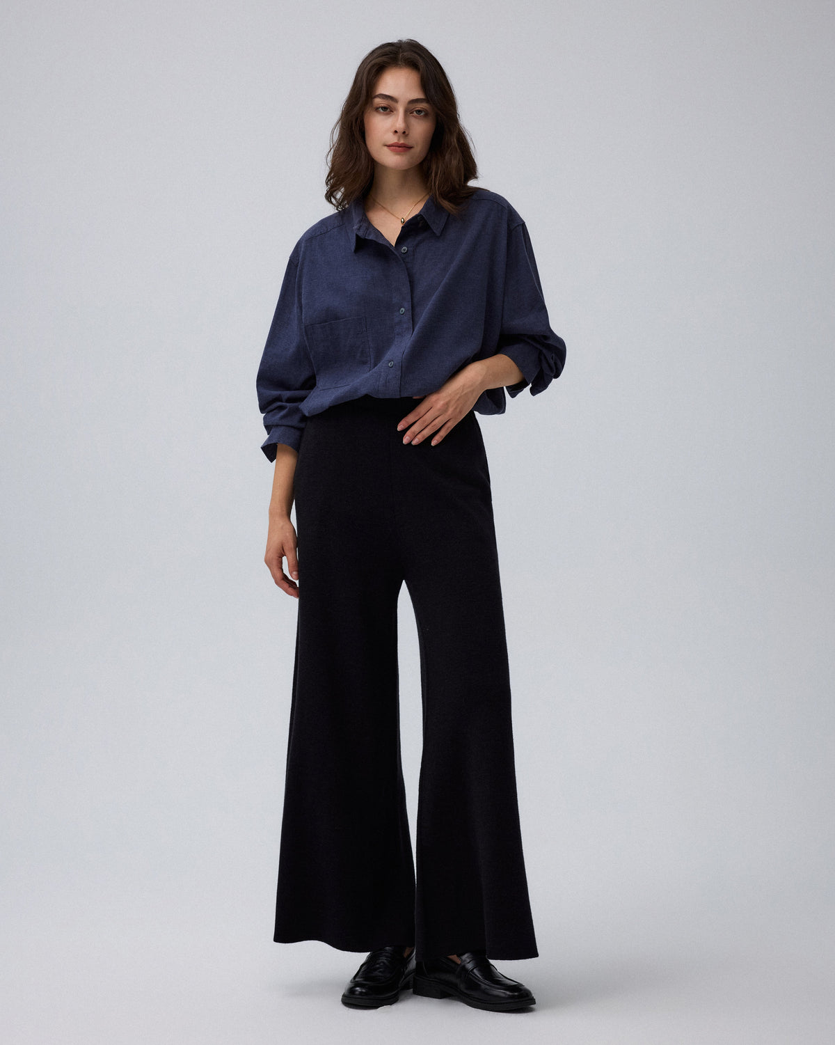 Juana Mid-Rise Cropped Pants in Black (merino wool–hemp–silk) styled with a fitted knit to highlight the pull-on waist.