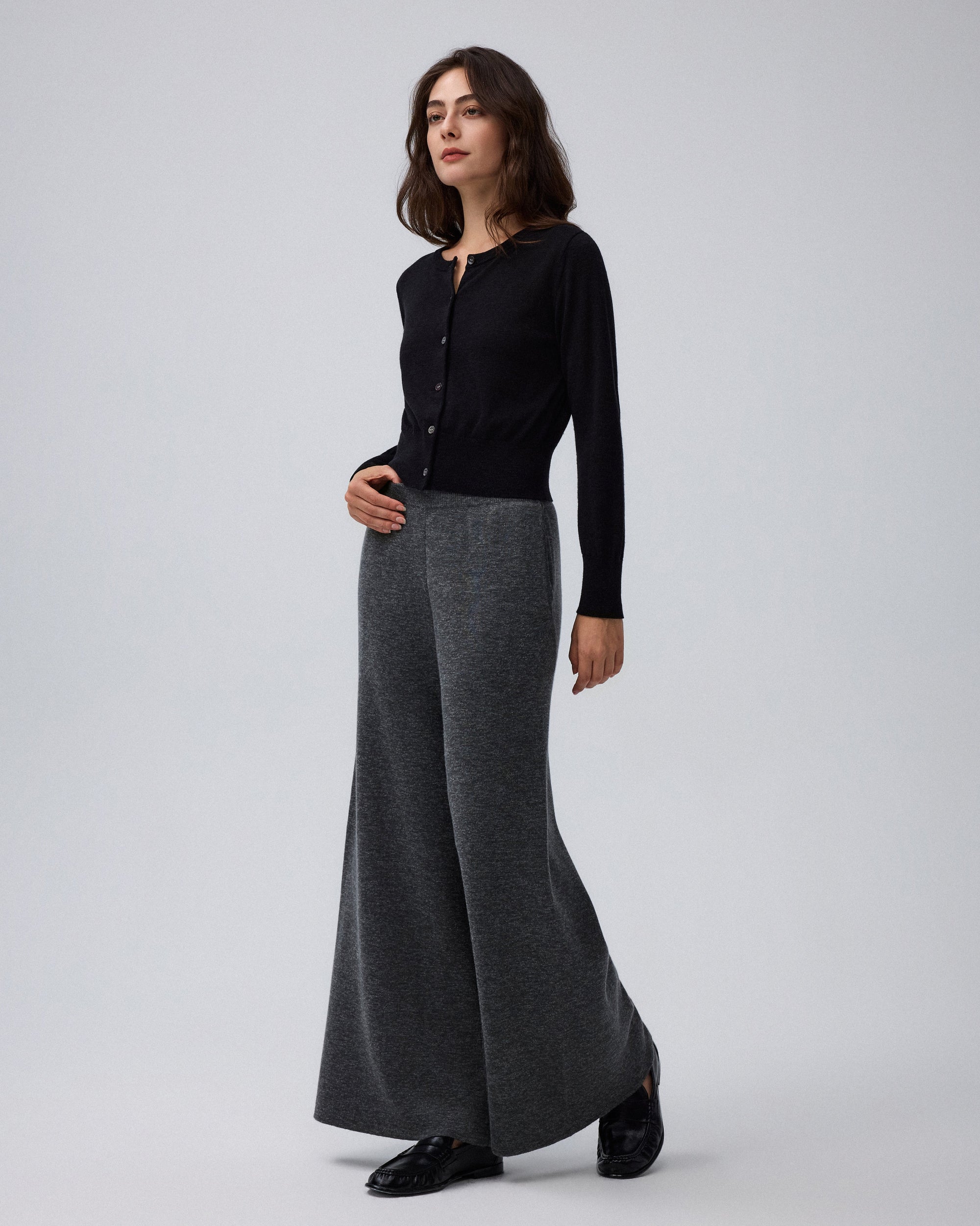 Juana Mid-Rise Cropped Pants in Charcoal (merino wool–hemp–silk) shown on a model from the front with the wide-leg shape visible.