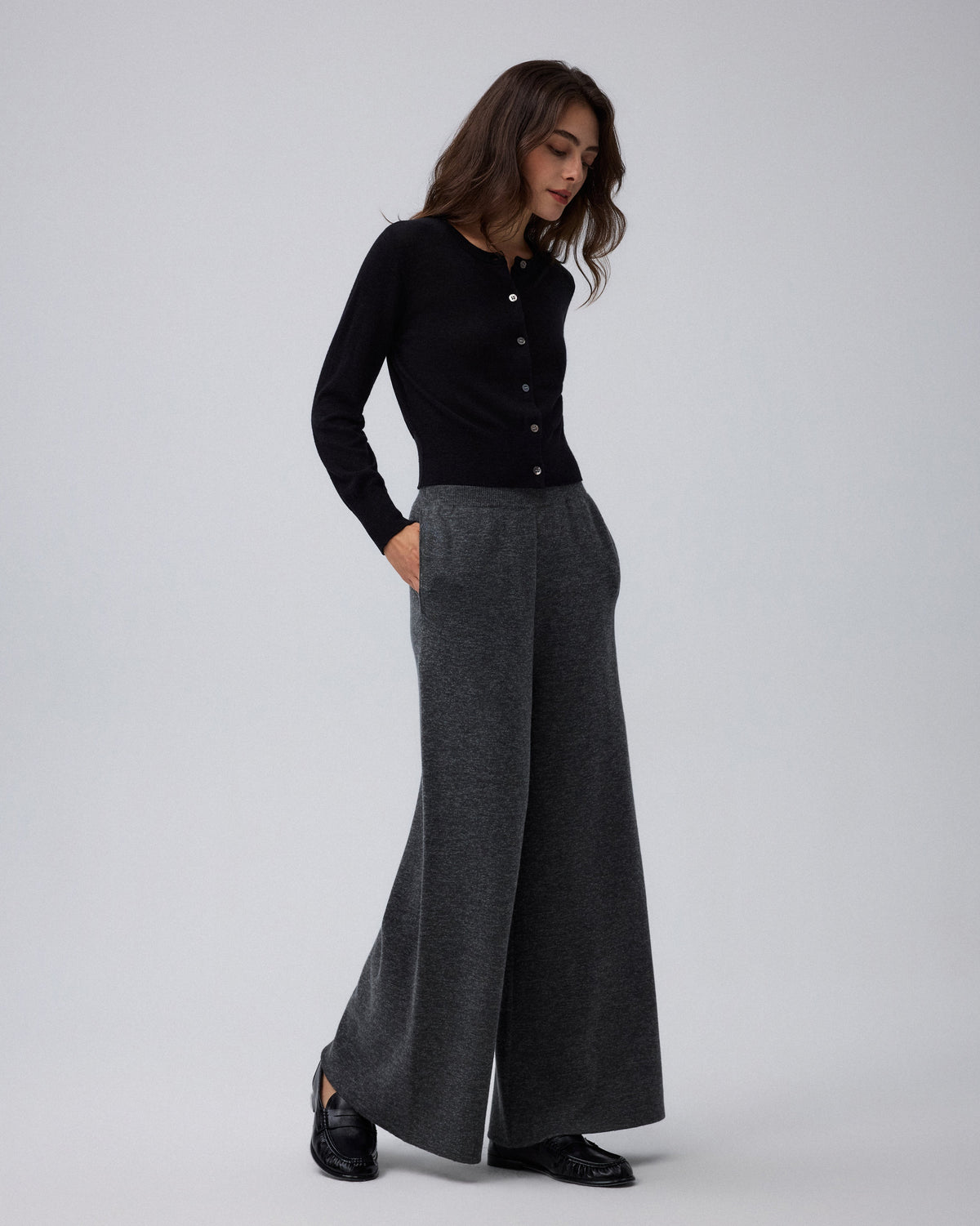 Juana Mid-Rise Cropped Pants in Charcoal (merino wool–hemp–silk) shown in side profile with the mid-rise waist and wide leg visible.