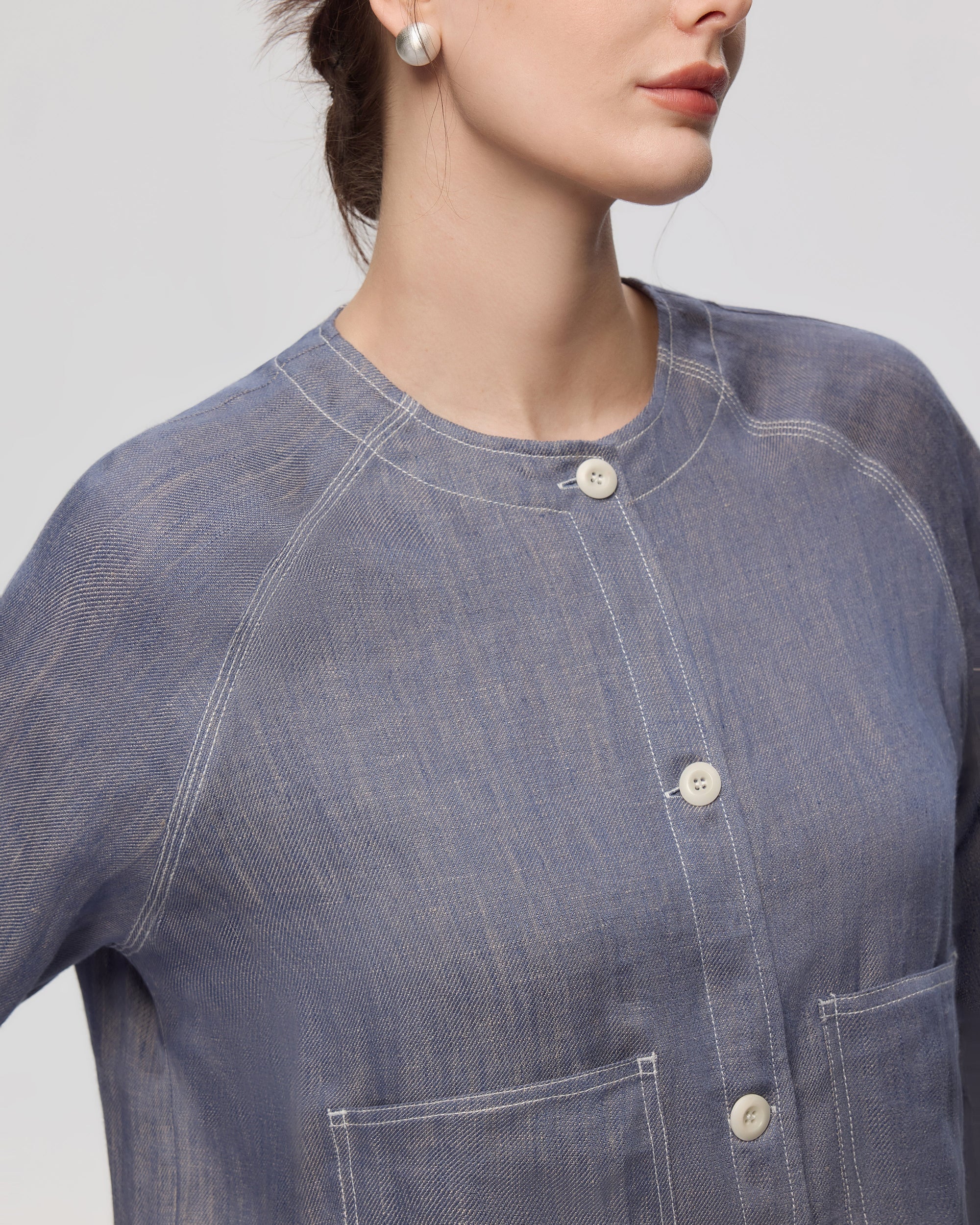 Juana Mira Boxy Jacket Steel blue (linen–hemp) on model detail showing pocket opening and stitching finish
