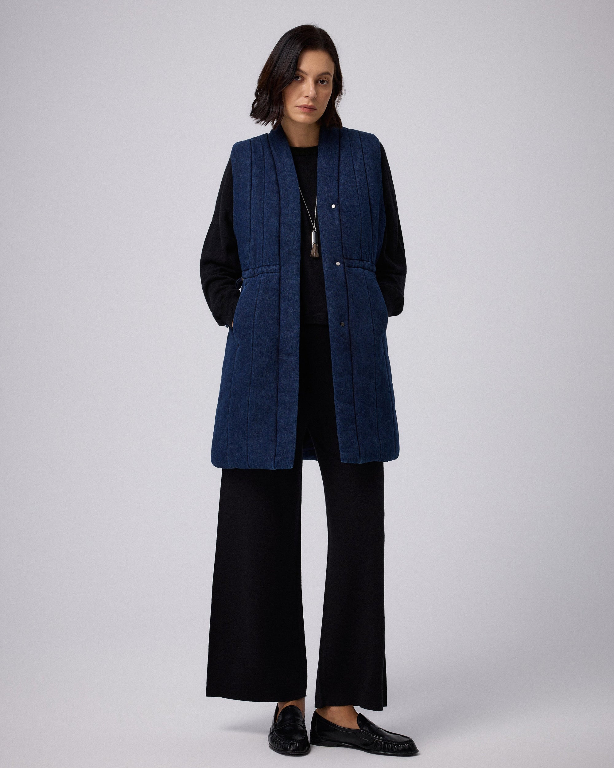 Juana Natural Fill Puffer Vest Dark Wash (organic cotton–hemp) styled in a complete layered look with an adjustable waist