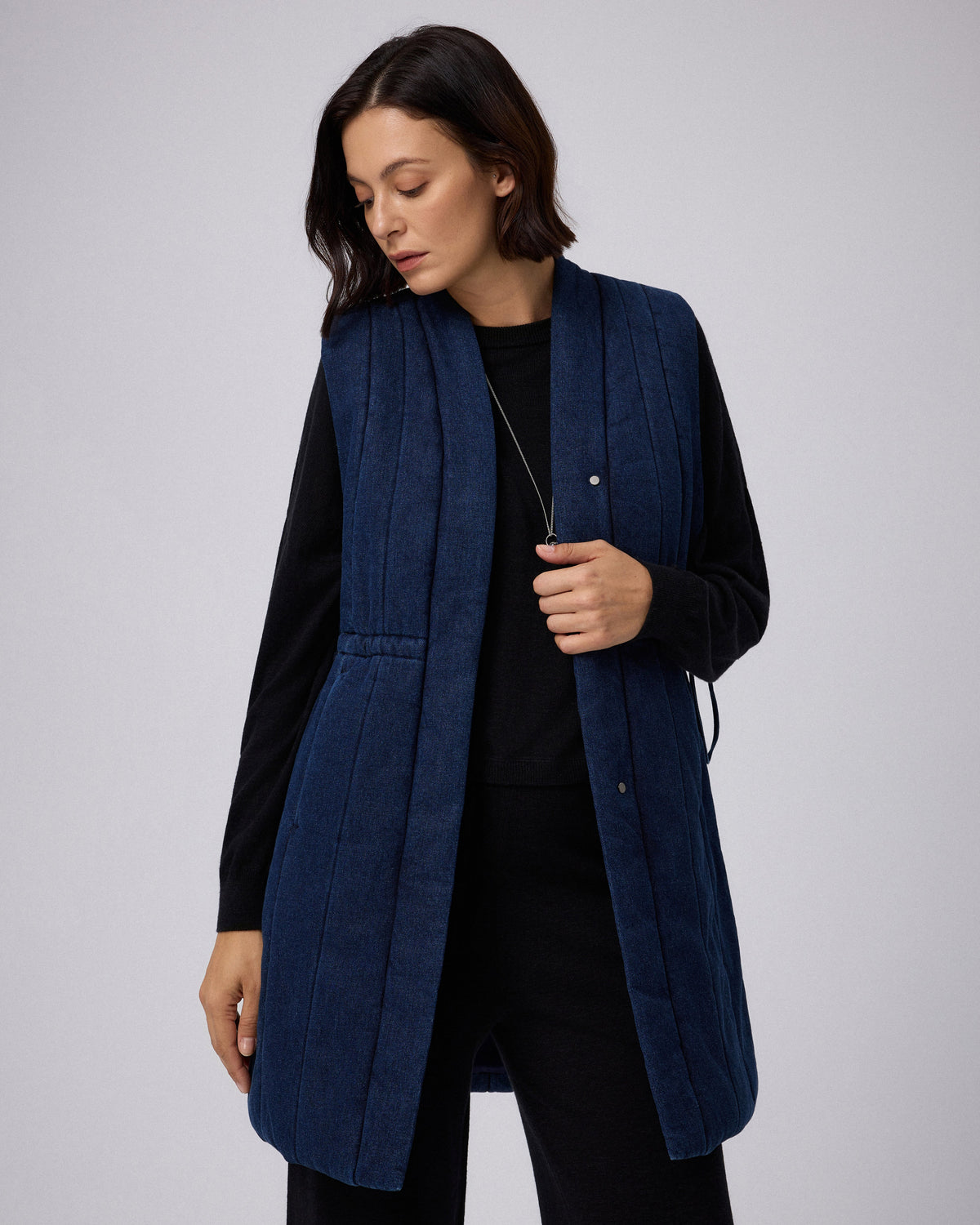 Juana Natural Fill Puffer Vest Dark Wash (organic cotton–hemp) styled over a lightweight knit for everyday layering