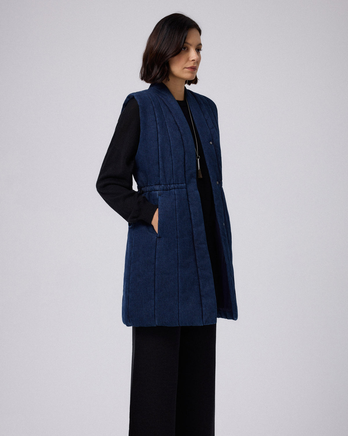 Juana Natural Fill Puffer Vest Dark Wash (organic cotton–hemp) side view showing the sleeveless cut and lightweight volume