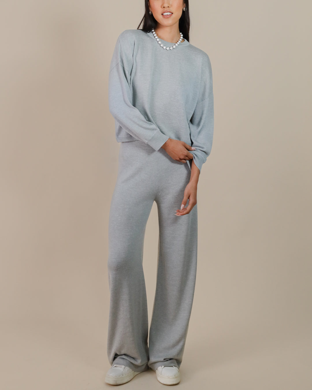 Model styling Juana Nilo Knitted Hemp Pull-on Pants with coordinated Nilo Knitted Hemp Crewneck for cozy, eco-friendly style.