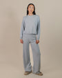 Woman wearing Juana Nilo Knitted Hemp Pull-on Pants in a relaxed setting, showcasing sustainable loungewear.