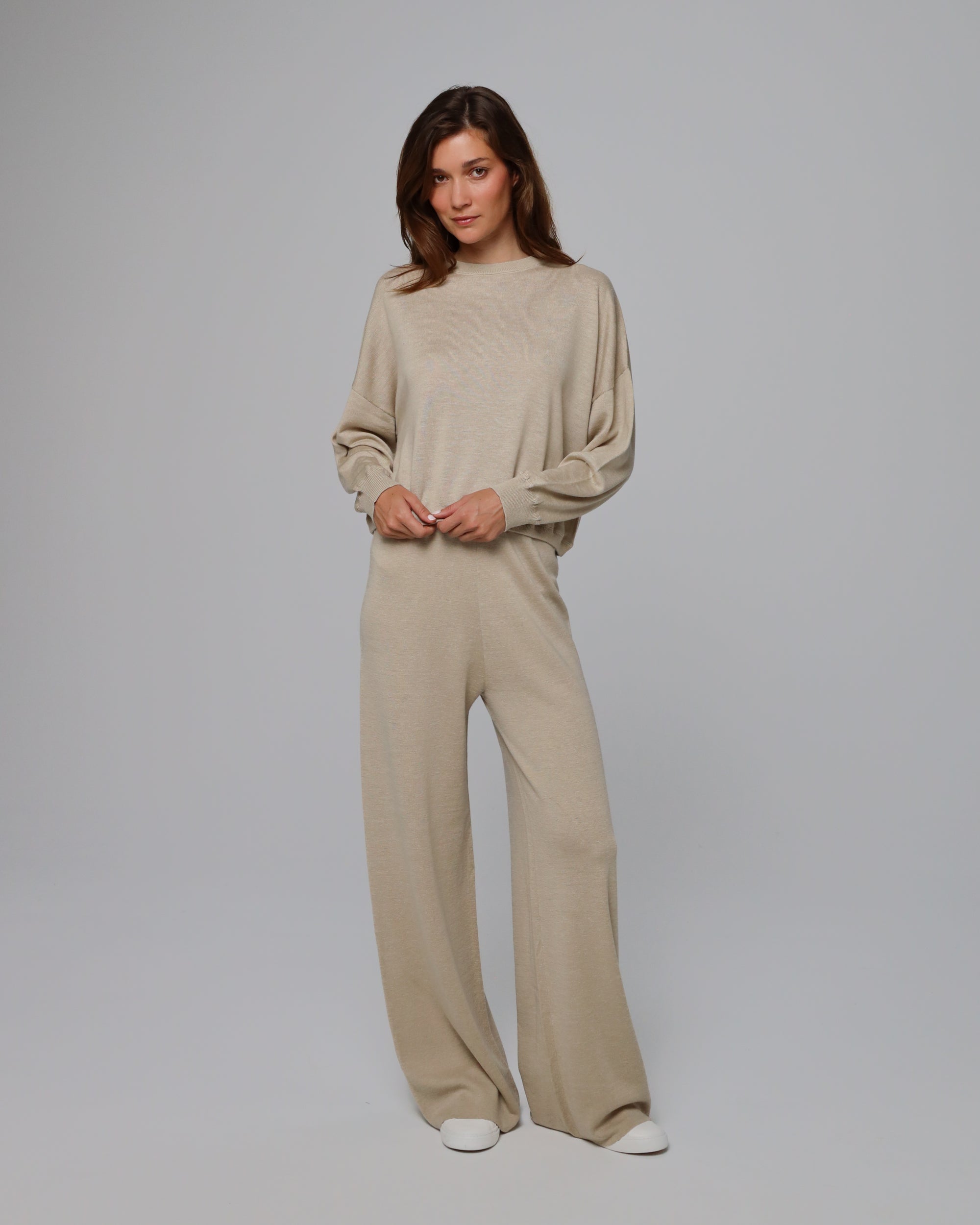 Full-body view of Nilo Knitted Hemp Crewneck (beige) paired with matching knit pants.