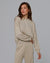 Woman wearing Juana Nilo Knitted Hemp Crewneck in beige merino–silk–hemp blend, styled for sustainable everyday wear.