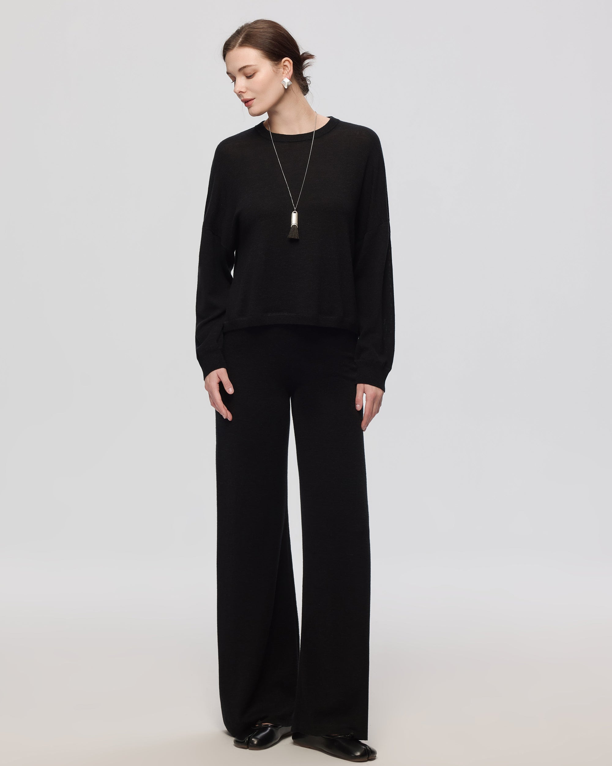 Full-body view of Nilo Knitted Hemp Pull-on Pants (black) paired with Nilo Crewneck for a coordinated knit look.