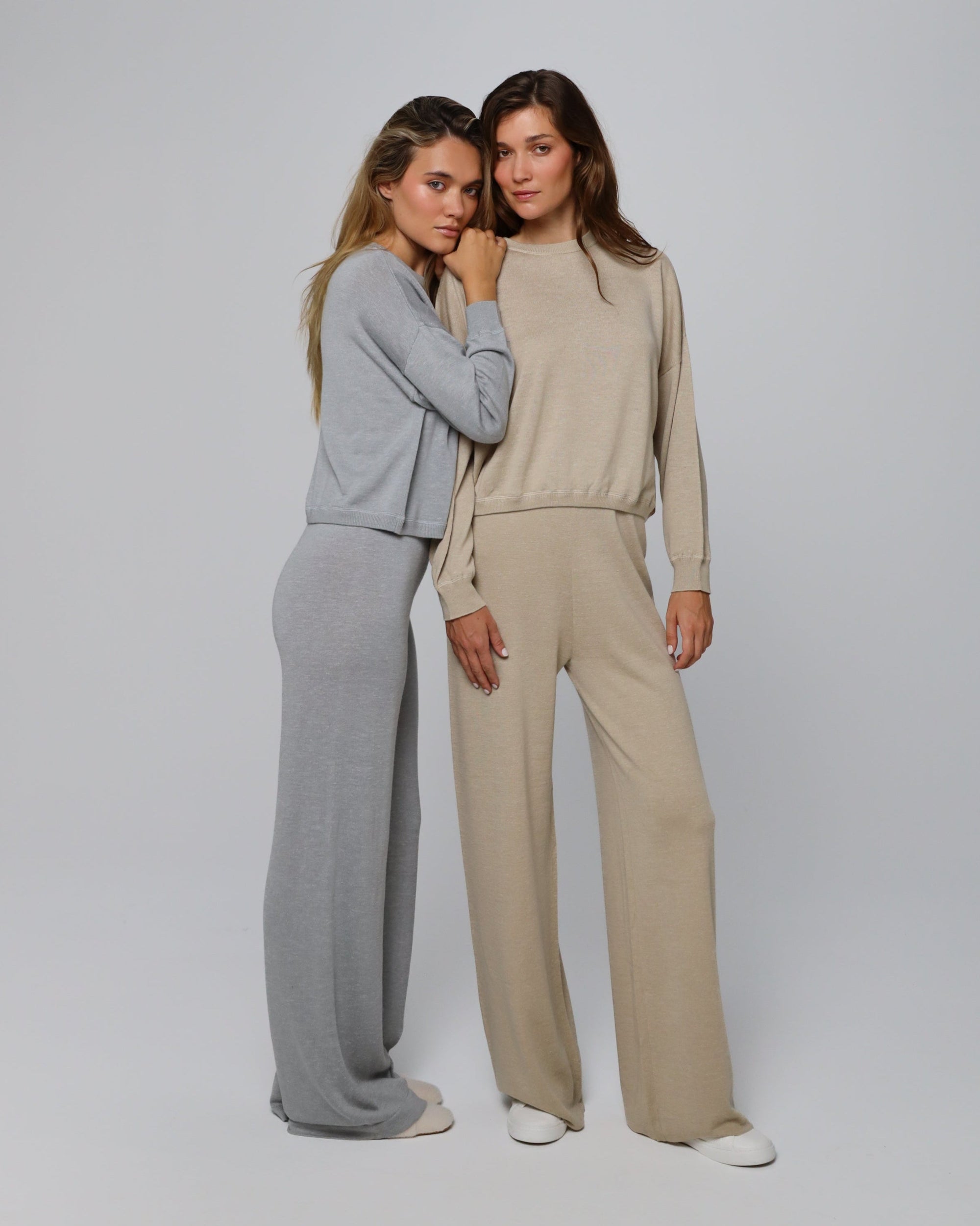 Women wearing Nilo Knitted Hemp Pull-on Pants (heather gray) with a tailored top for elevated lounge style.