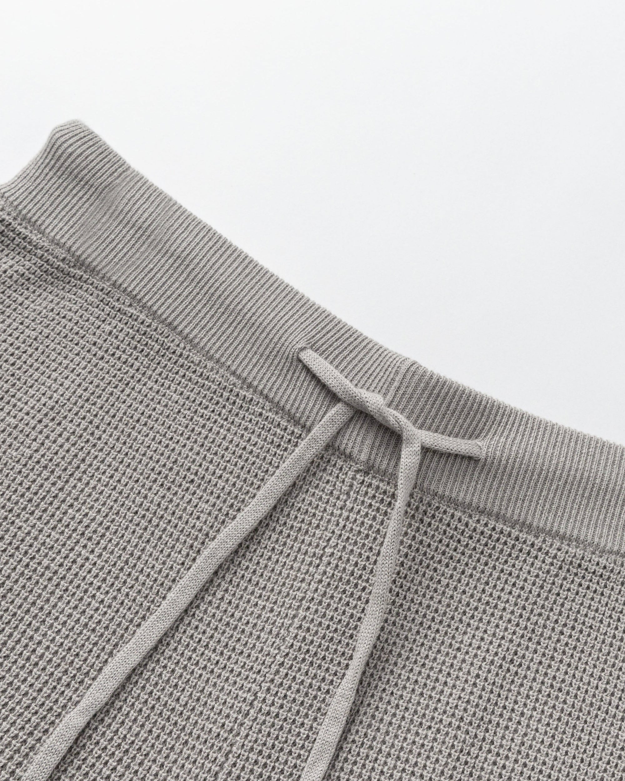 Juana Noa Open Knit Shorts light gray (cotton–hemp) layflat showing open-knit texture and elastic waistband