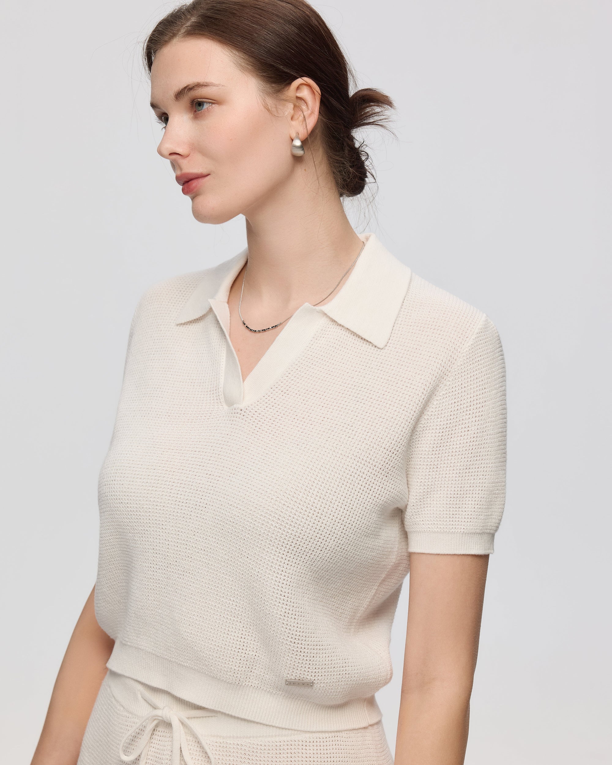Juana Noa Open Knit Top cream (sustainable cotton–hemp) side view on model highlighting cropped length