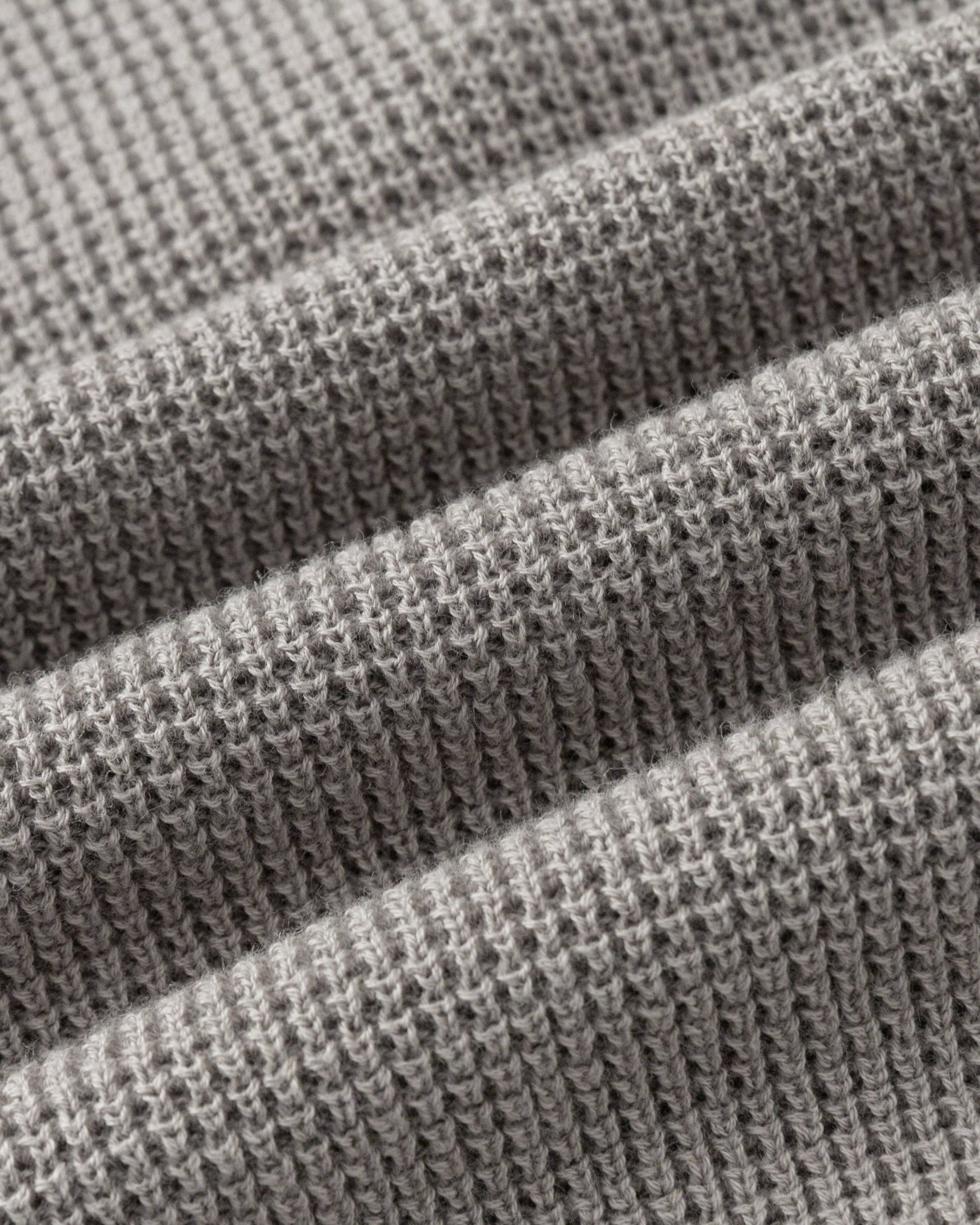 Juana Noa Open Knit Top light gray (sustainable cotton–hemp) textile close-up showing breathable open-knit pattern