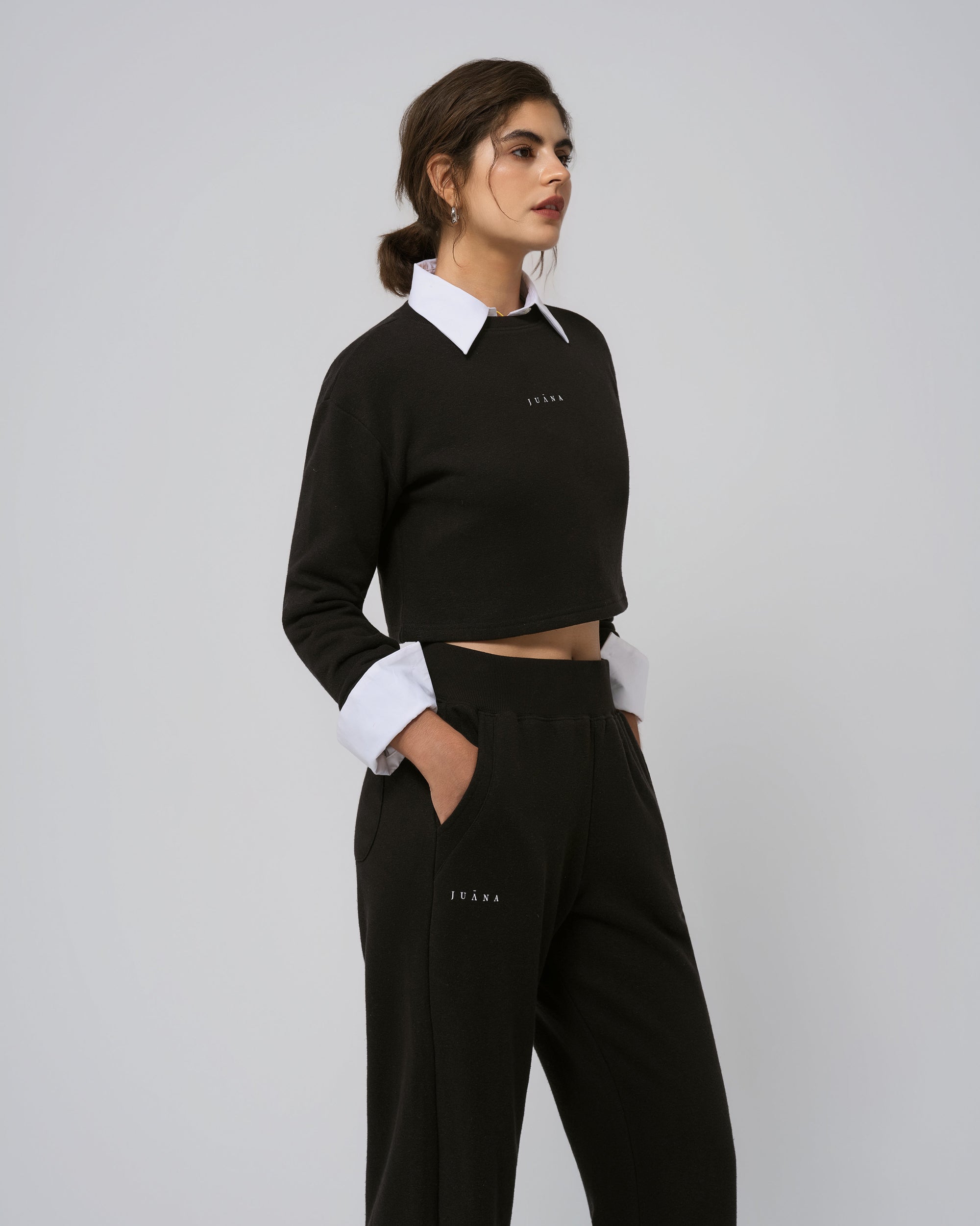 Layered with light jacket; Off Hours Crewneck Sweater in black, soft drape in motion.