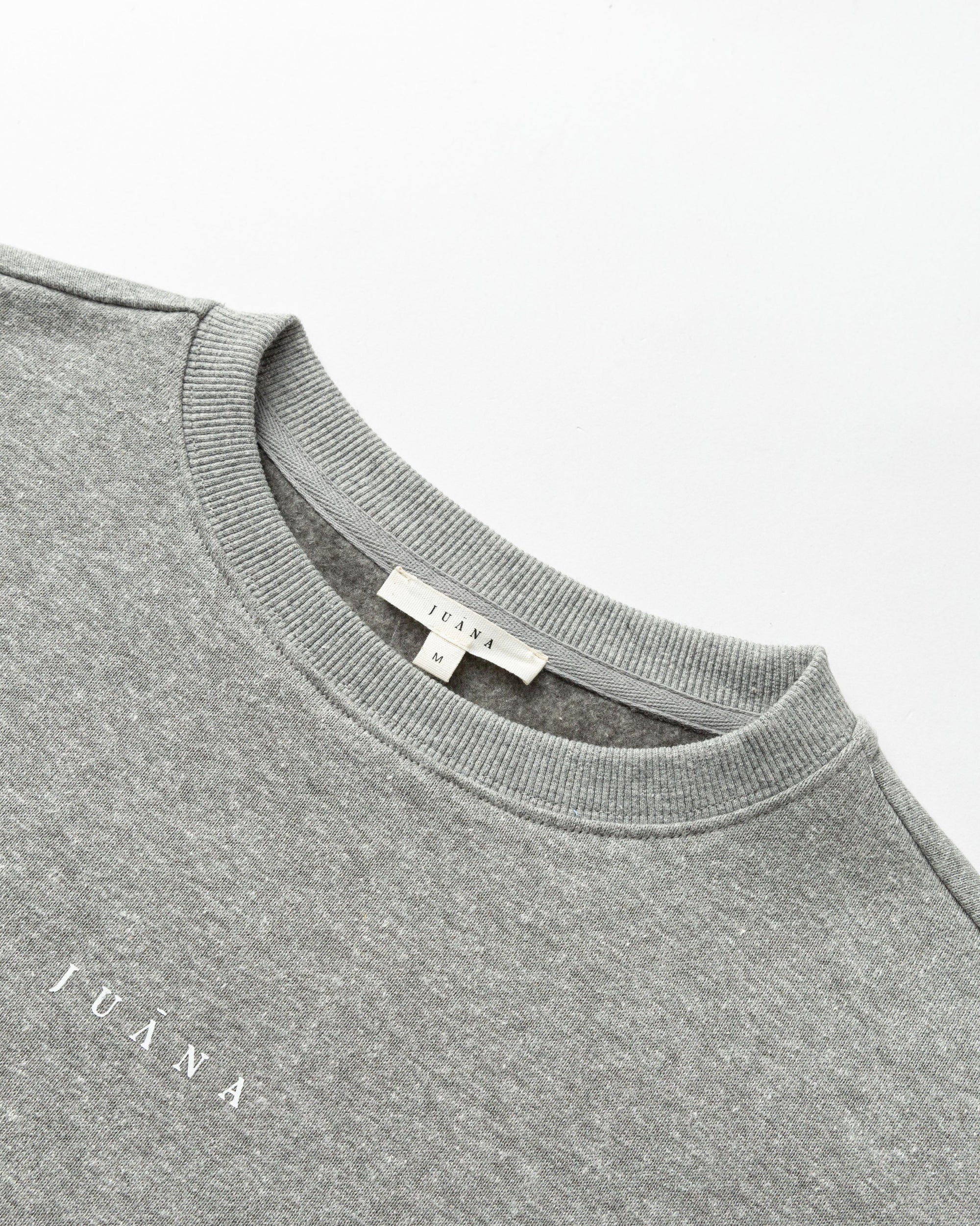 Detail shot of neckline, cuff, and knit texture on Off Hours Crewneck Sweater (grey).