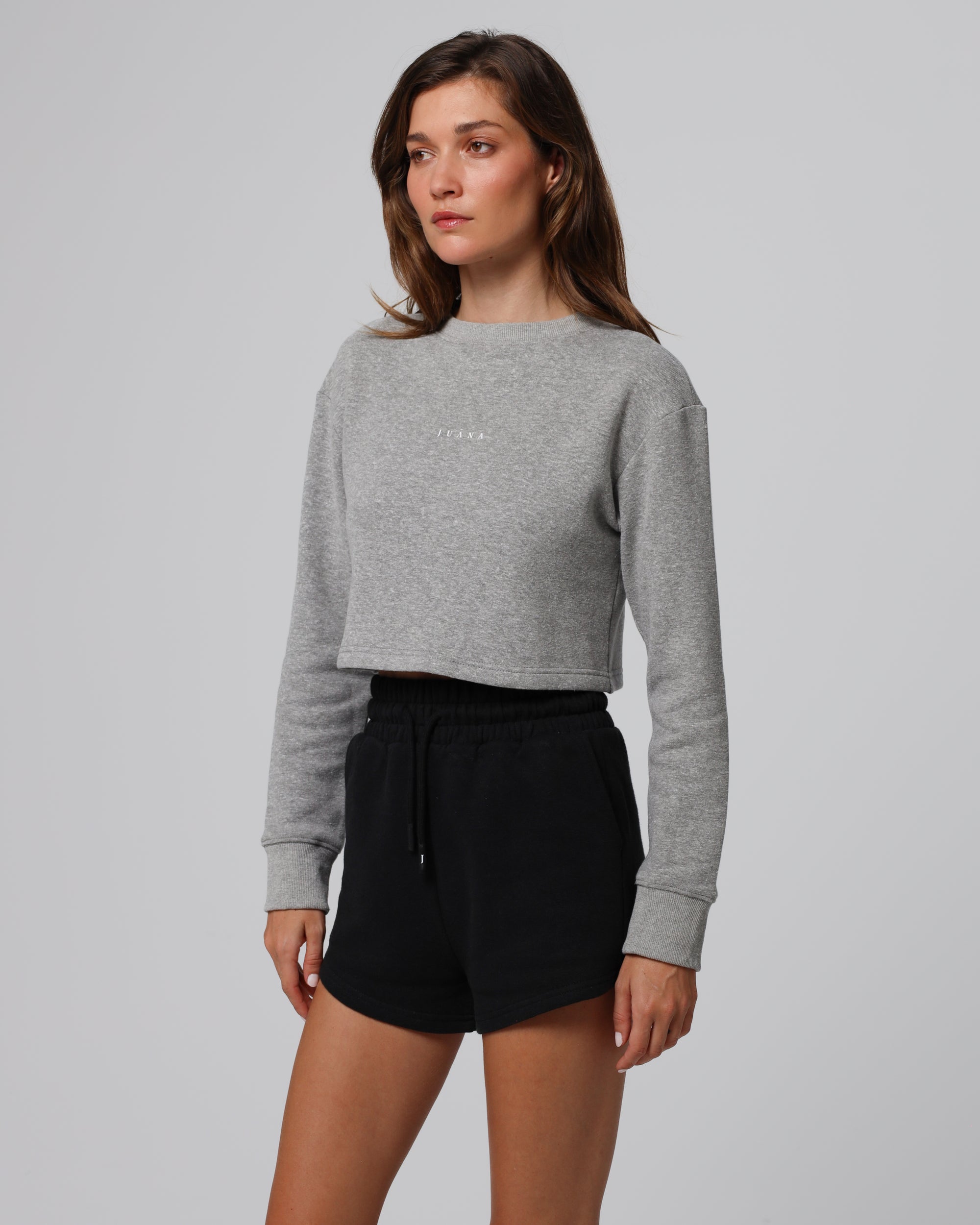 Woman wearing Juana Off Hours Crewneck Sweater in a hemp–Tencel™ blend (natural), styled for sustainable everyday wear.