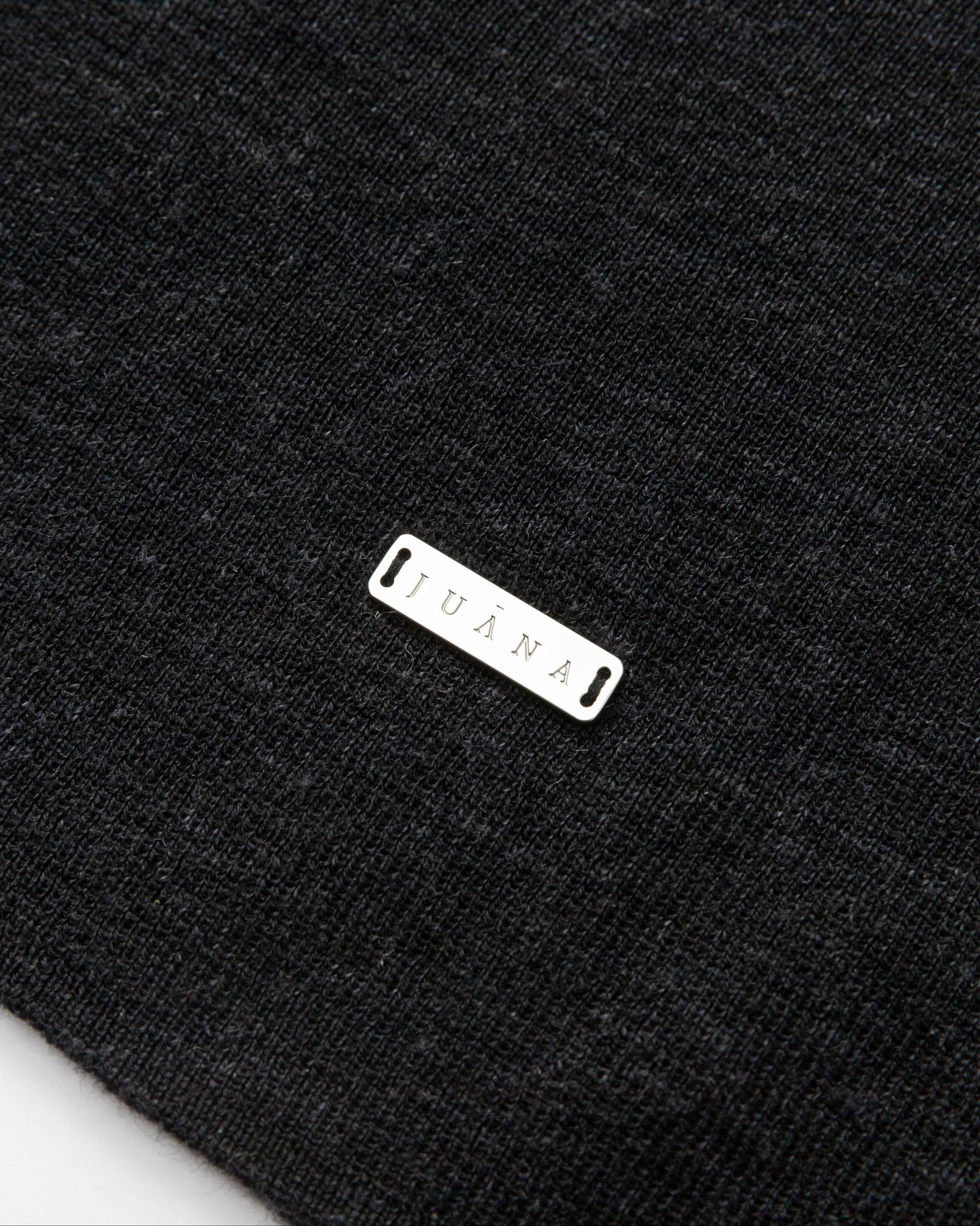 Flat lay of Ossa Knitted Hemp Turtleneck (black), showing fine-gauge knit and minimal finishing.