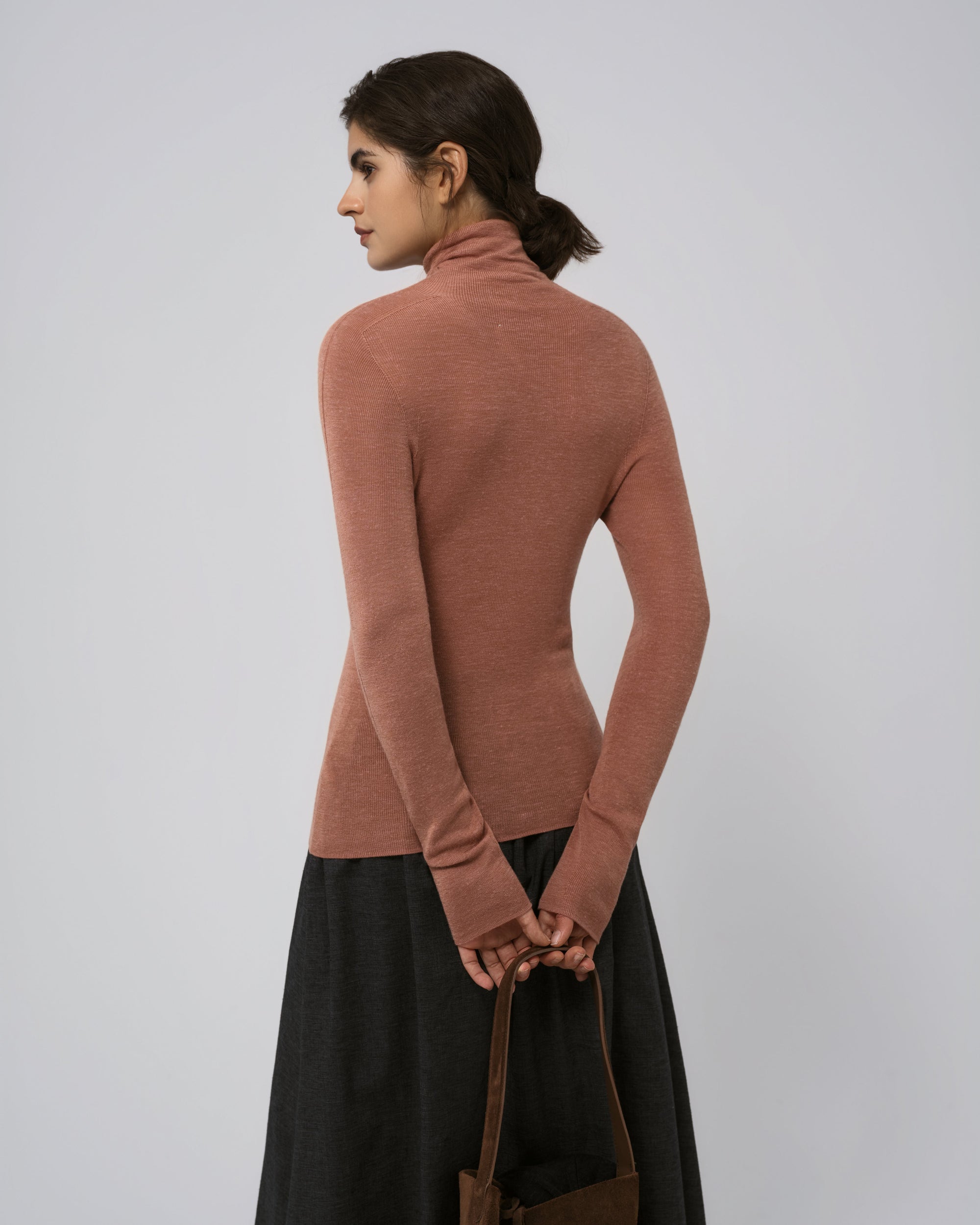 Ossa Knitted Hemp Turtleneck (Mocha Mousse) on model, back view showing refined knit and close fit.