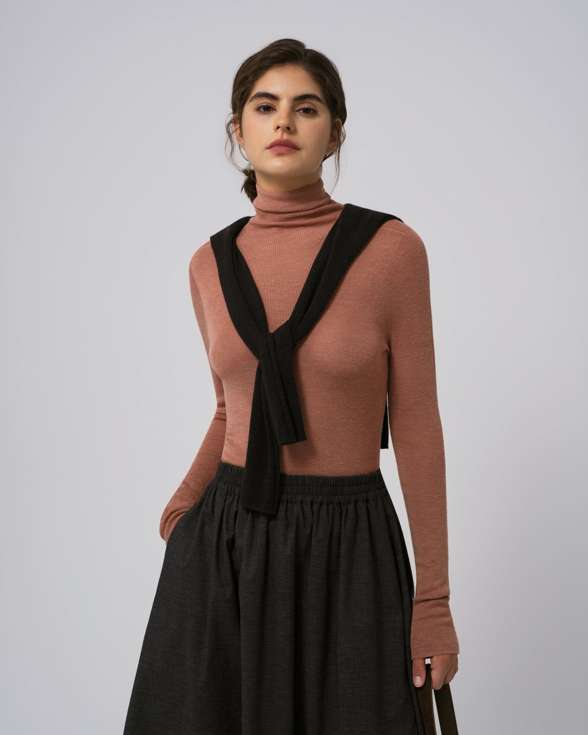 Woman wearing Juana Ossa Knitted Hemp Turtleneck in Mocha Mousse merino–silk–hemp blend, showing close, flattering fit.