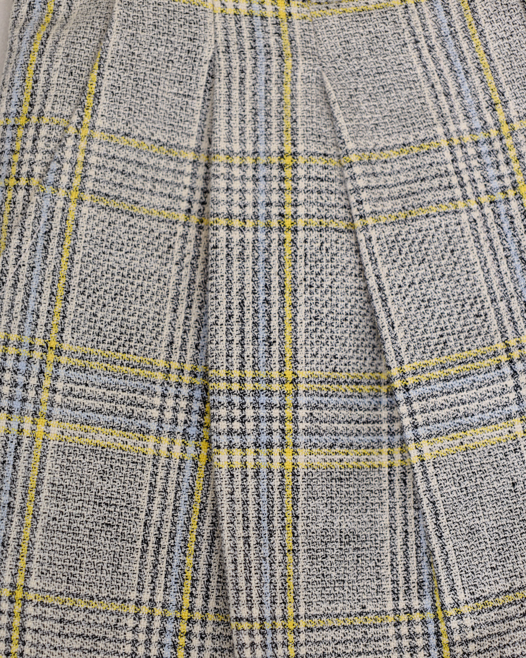 Close-up of Juana Plaid Theory High Rise Trousers showing plaid pattern and sustainable fabric texture.