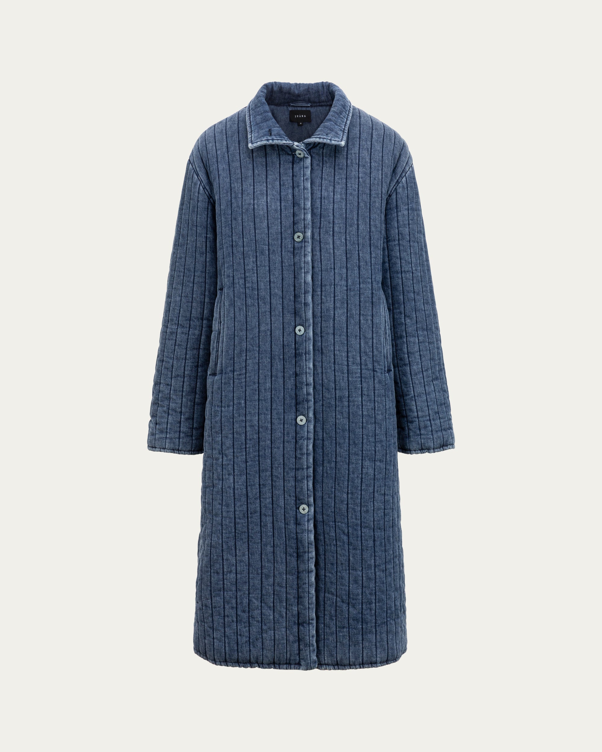 Juana Quilted Denim Jacket in Indigo Wash (organic cotton–hemp) shown from the front with coconut buttons and deep front pockets.