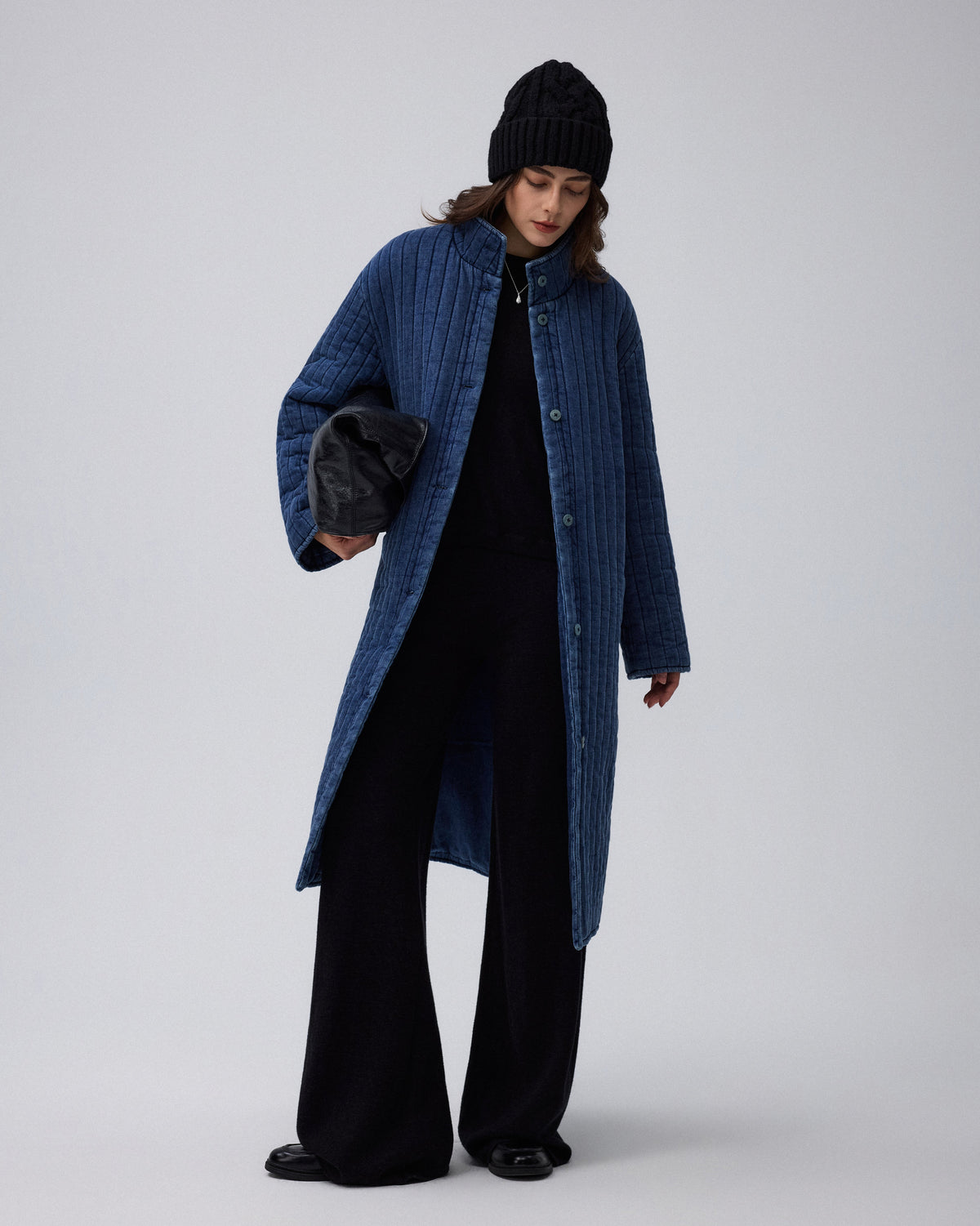 Juana Quilted Denim Jacket in Indigo Wash (organic cotton–hemp) shown in a complete outfit with its softly structured quilted shape visible.