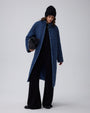 Juana Quilted Denim Jacket in Indigo Wash (organic cotton–hemp) shown in a complete outfit with its softly structured quilted shape visible.