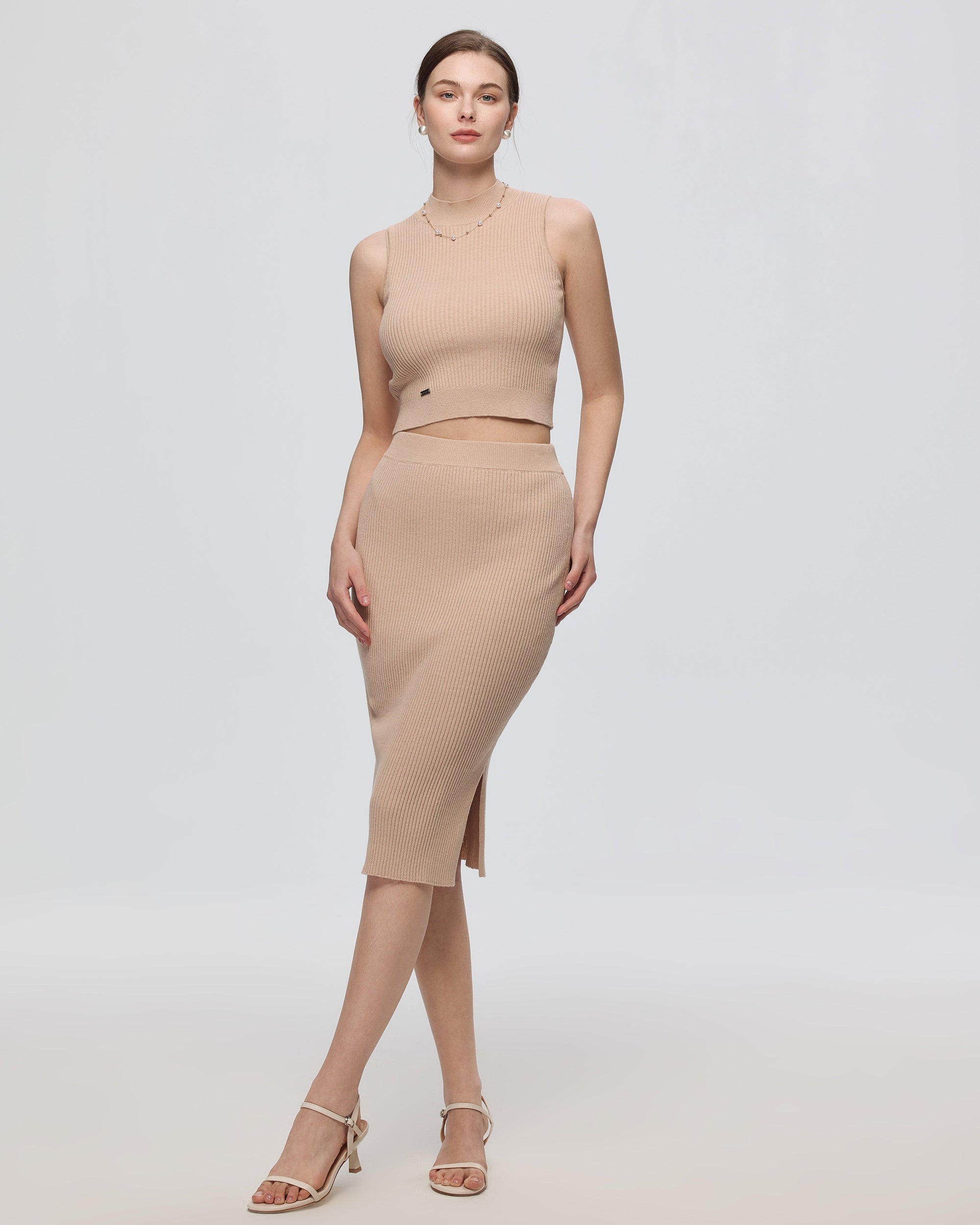 Juana Sera Rib Knit Skirt tan (sustainable hemp–cotton) on model showing body-skimming fit and rib knit texture