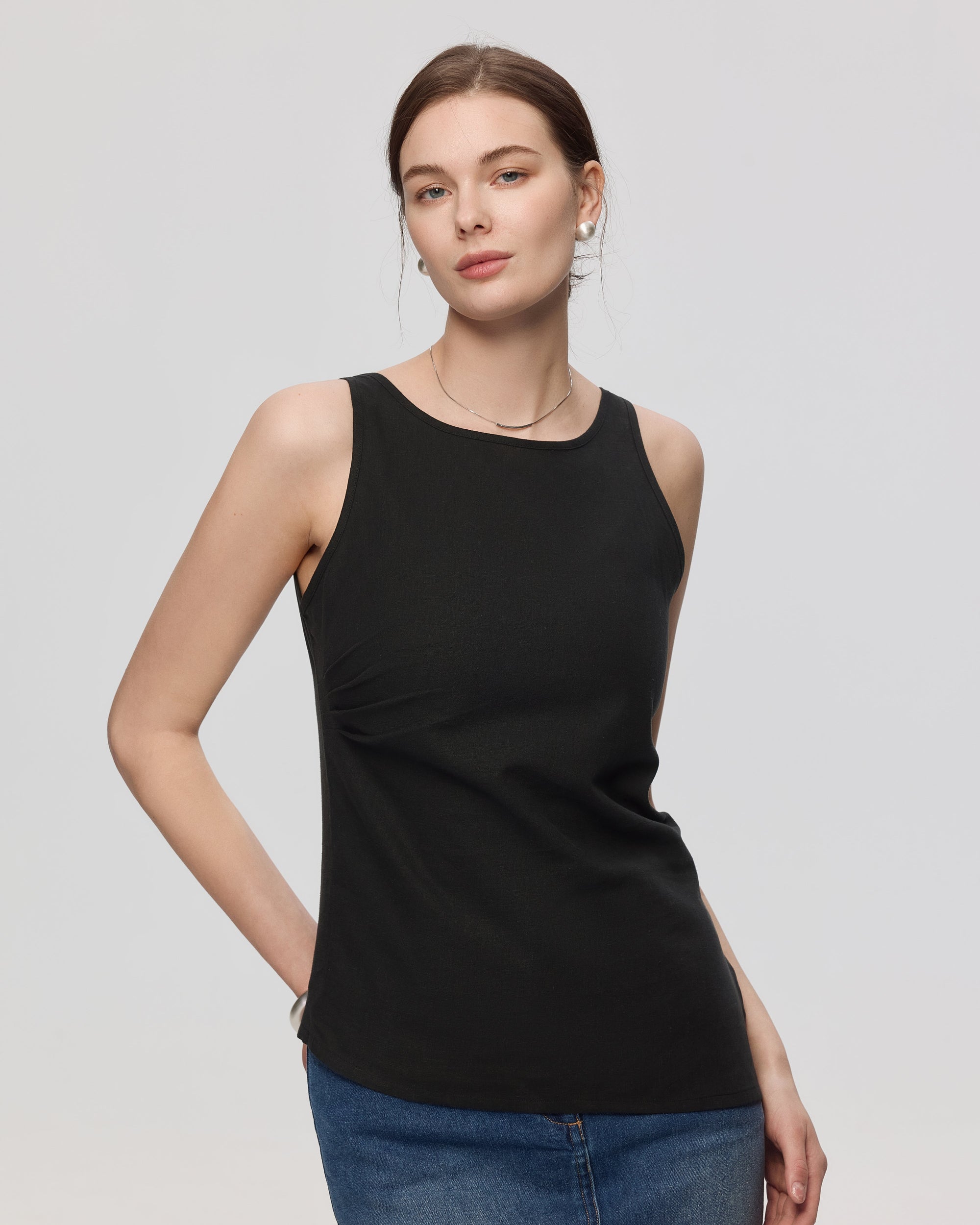 Juana Sienna Pleated Tank black (hemp–cotton) styled on model showing clean front lines