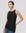 Juana Sienna Pleated Tank black (hemp–cotton) on model showing asymmetrical hem and sleeveless fit