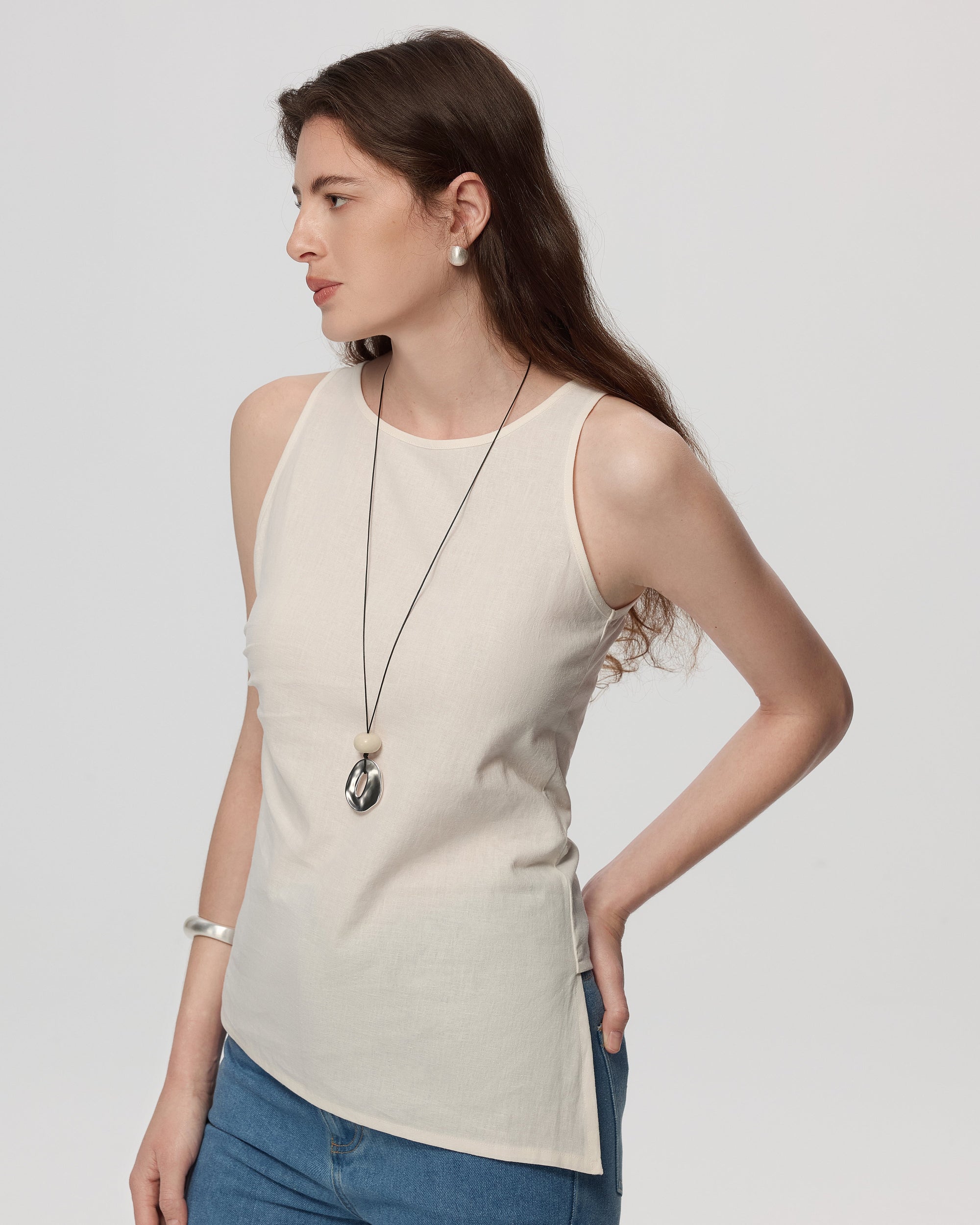Juana Sienna Pleated Tank white (hemp–cotton) side view on model showing drape and asymmetrical hem