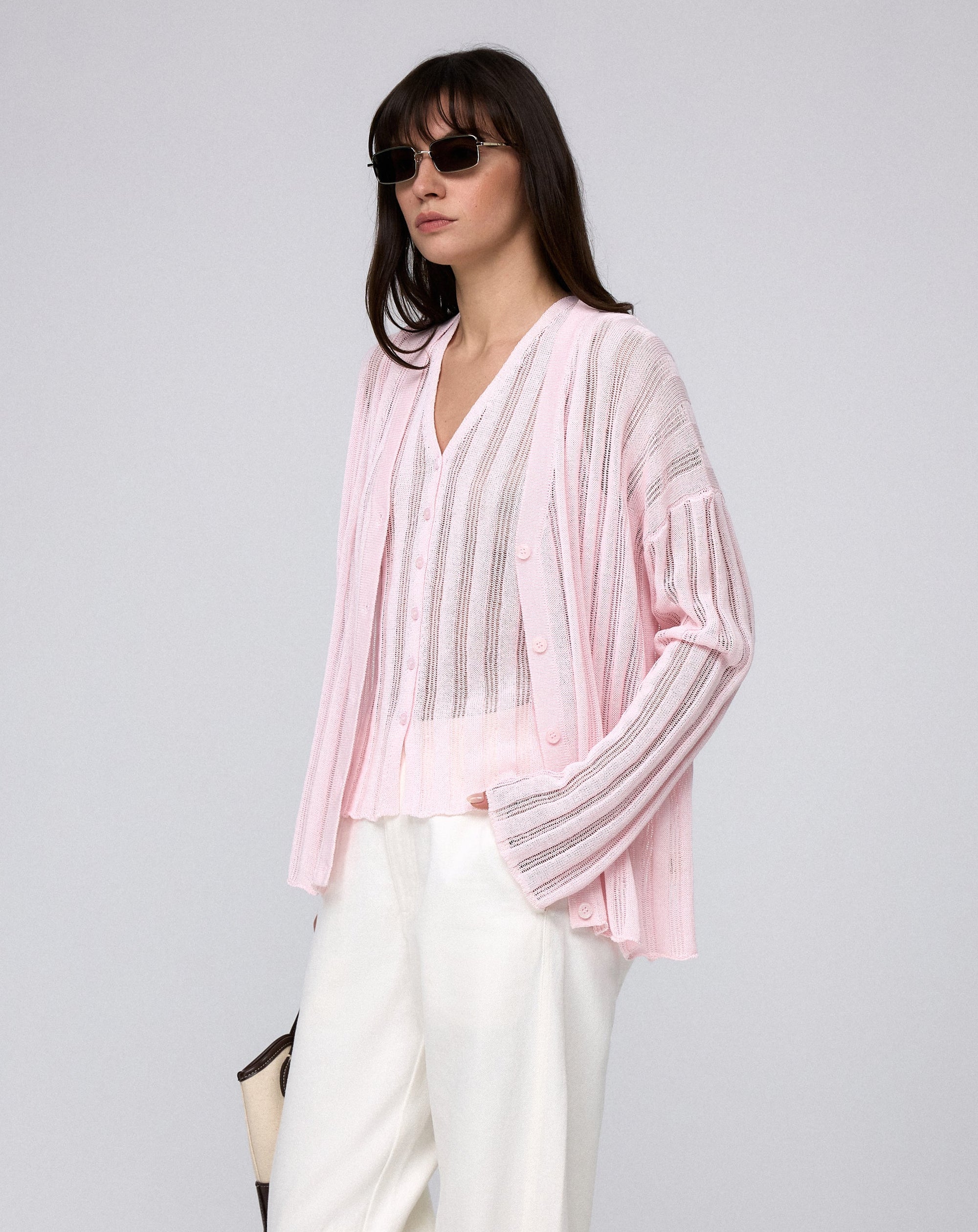 Juana Sumire Open Knit Striped Cardigan light pink (cotton–cellulose–rayon blend) model side view with relaxed silhouette