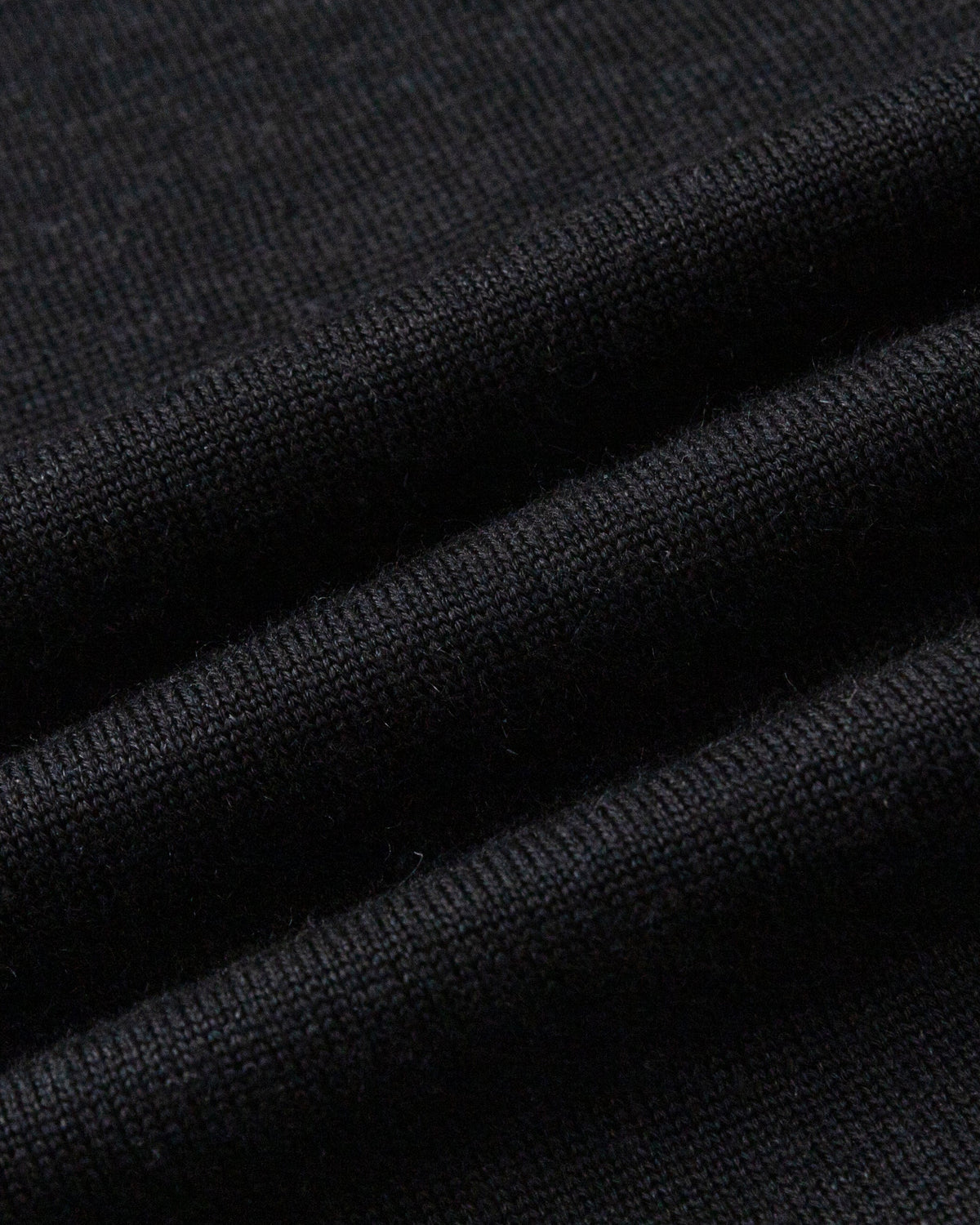 Juana Turtleneck Maxi Dress in Black (merino wool–hemp–silk blend) shown close up to highlight the lightweight natural-fiber textile.