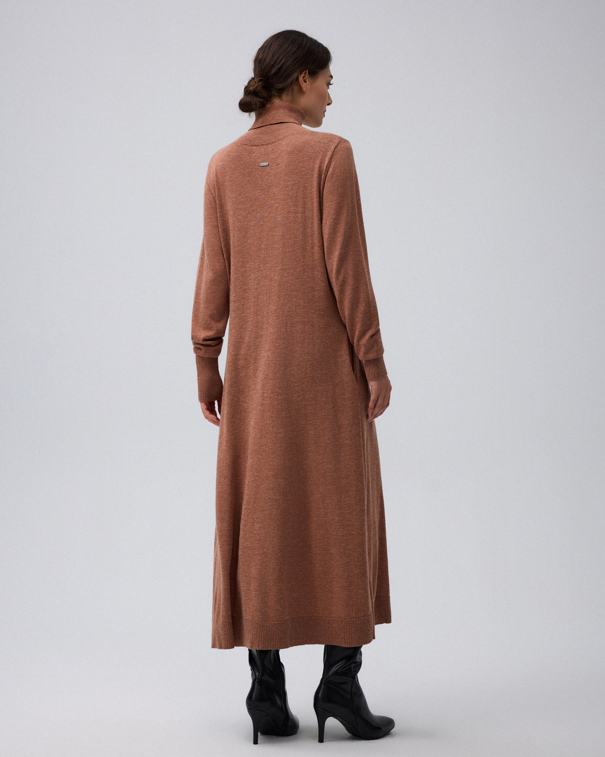 Juana Turtleneck Maxi Dress in Chestnut (merino wool–hemp–silk blend) modeled from the back to show the flowing A-line maxi shape.