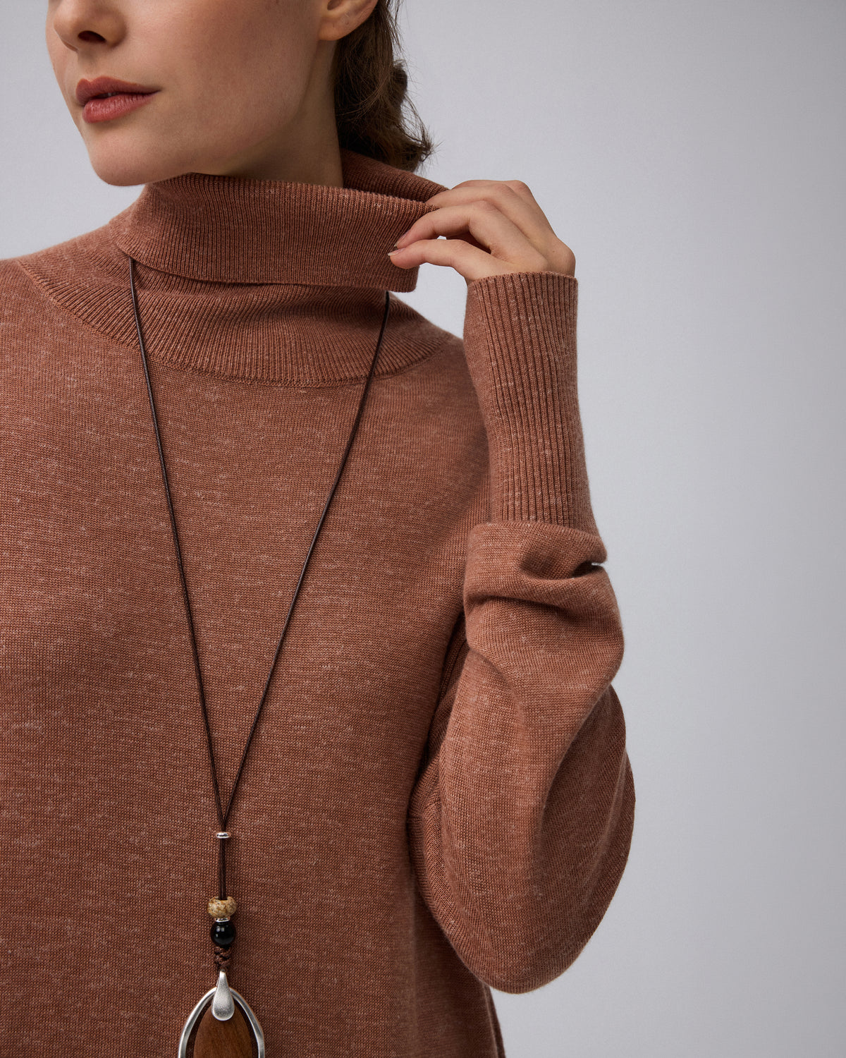 Juana Turtleneck Maxi Dress in Chestnut (merino wool–hemp–silk blend) shown close up with the turtleneck and bishop sleeve