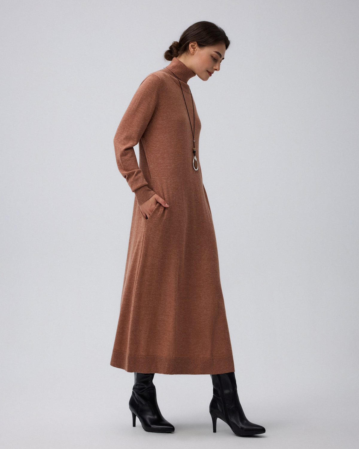 Juana Turtleneck Maxi Dress in Chestnut (merino wool–hemp–silk blend) styled for an elevated look with subtle bishop sleeves and a fluid drape.
