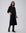 Juana Wide Leg Culotte Shorts Black (hemp–cotton) styled in a complete outfit with the narrow waistband visible