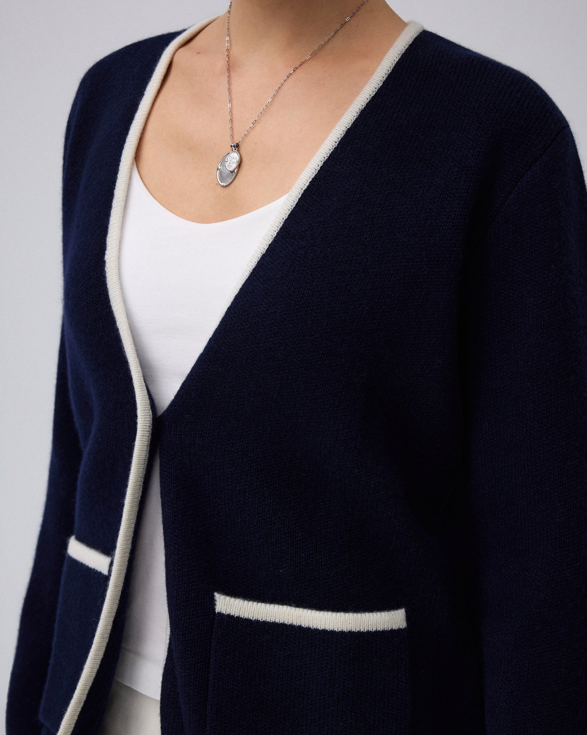 Juana Wool Cashmere Sweater Blazer in Navy (wool–cashmere) showing the natural abalone shell button and patch pocket