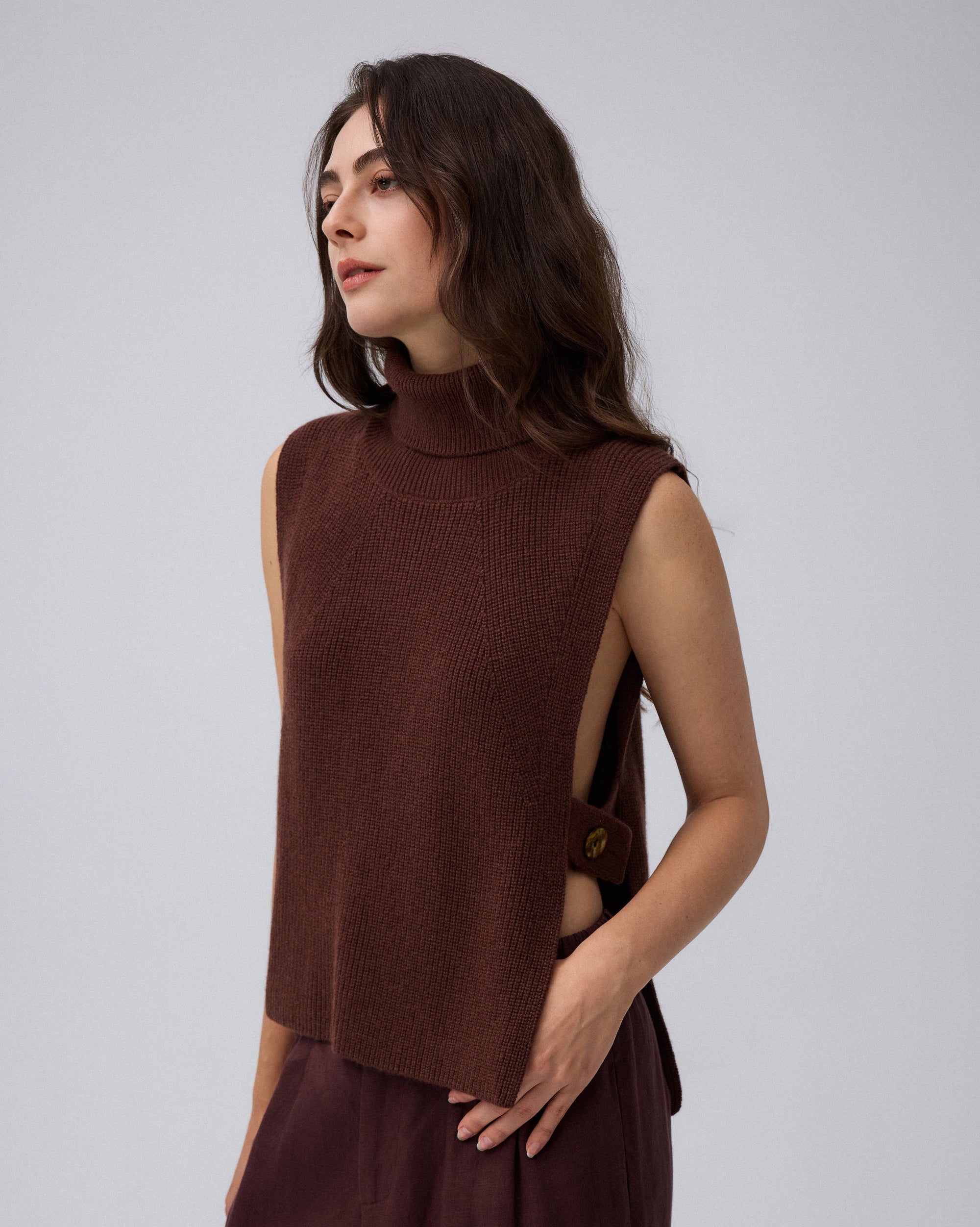 Juana Wool Cashmere Sweater Vest in Chocolate (wool–cashmere) worn on a model in a front view with the open-side silhouette visible.