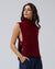 Juana Wool Cashmere Sweater Vest in Pomegranate (wool–cashmere) styled over a lightweight shirt with the shell side straps visible.