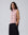 Juana Wool Cashmere Sweater Vest in Rose (wool–cashmere) worn on a model in a front view with the open-side silhouette visible.