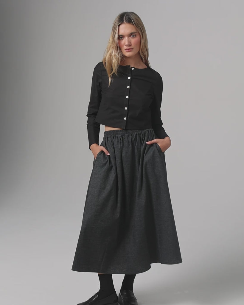 360° video of model wearing Hemp Blend Maxi Skirt (black), showing movement, drape, and silhouette.